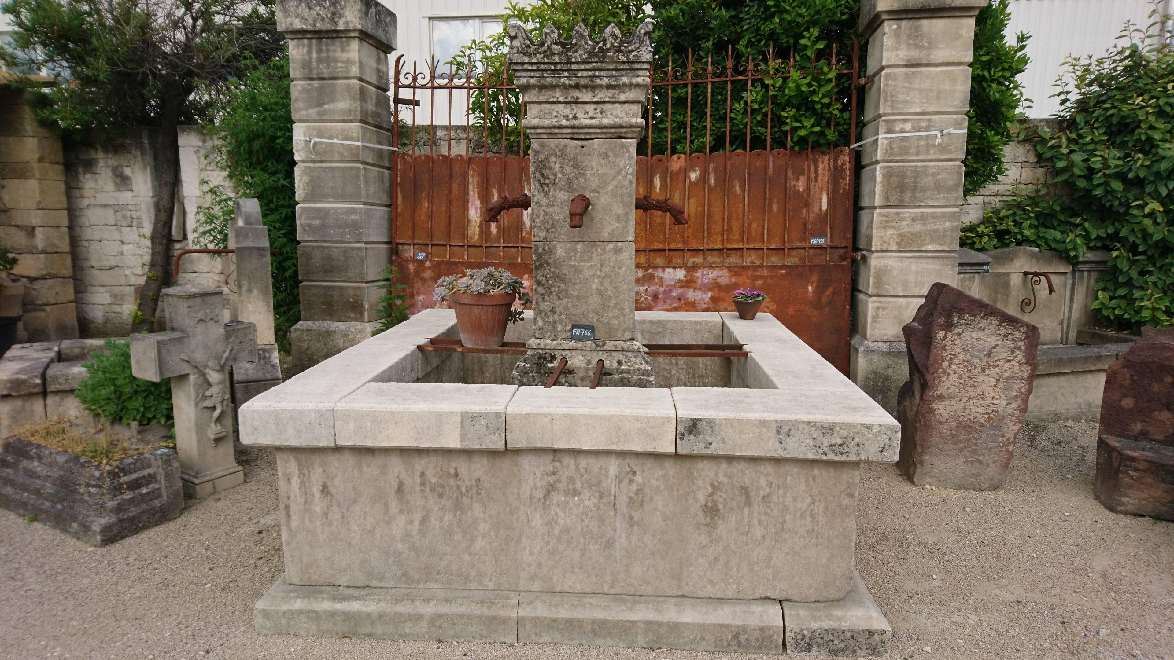 This unique central fountain is composed of reclaimed materials and created in our workshops located in Provence (France) by our Master Craftsmen.

Its basin (height of 79 cm) is square and made of thick elements of antique stone. The stones