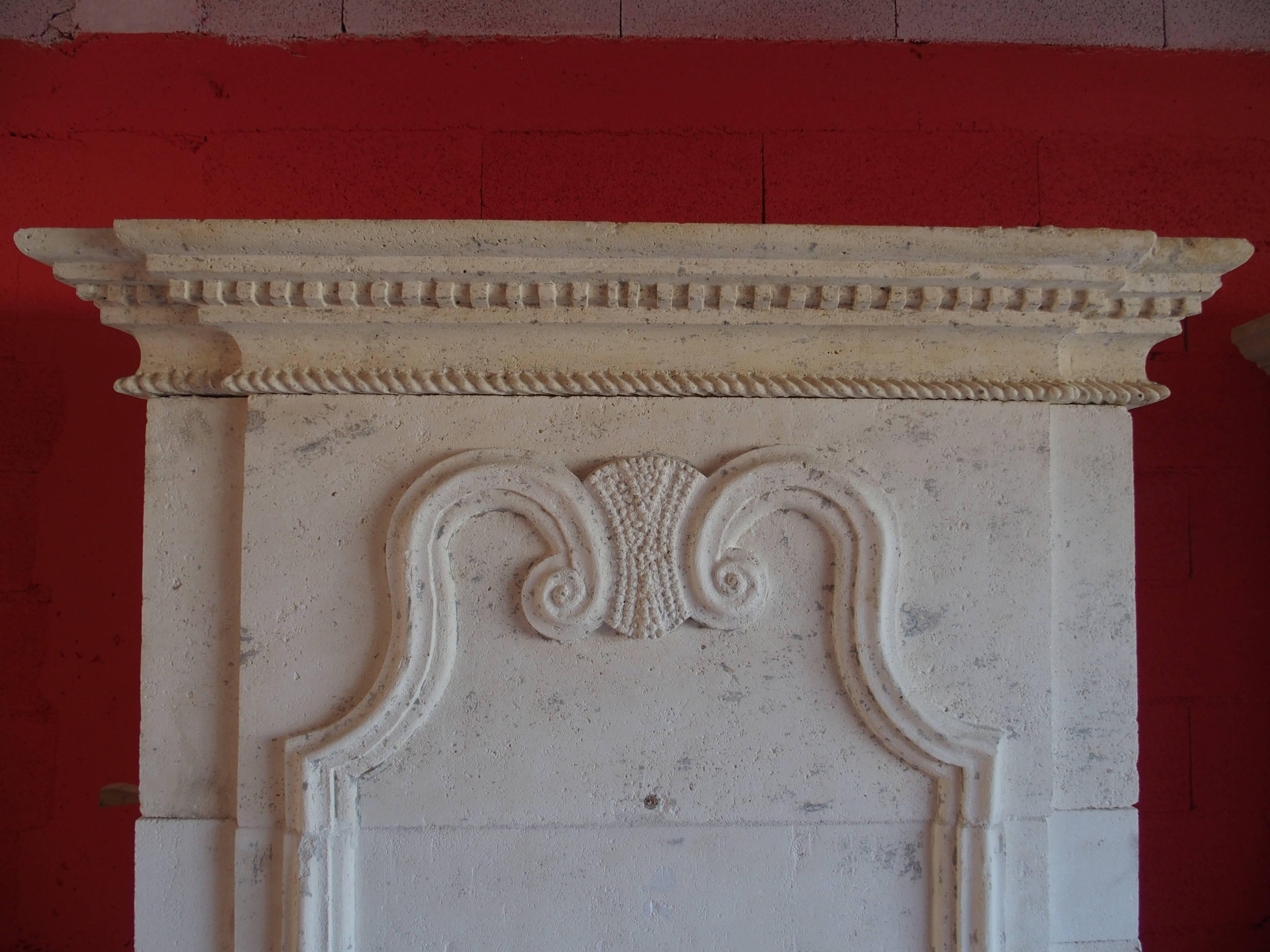 Hand-Carved 18th Century Louis XVI Stone Fireplace with Trumeau and Geometric Design, France For Sale