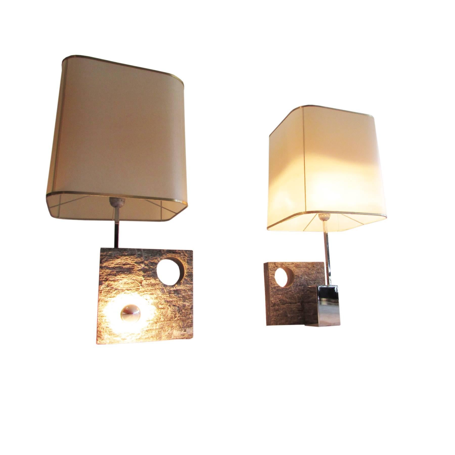 Set of two French table lamps coming from the chic ski resort of Courchevel.
Perforated slate base with chrome structure and perspex shade.
The lamps have two bulbs each, one under the shade and another, smaller and mirrored, at the back of the