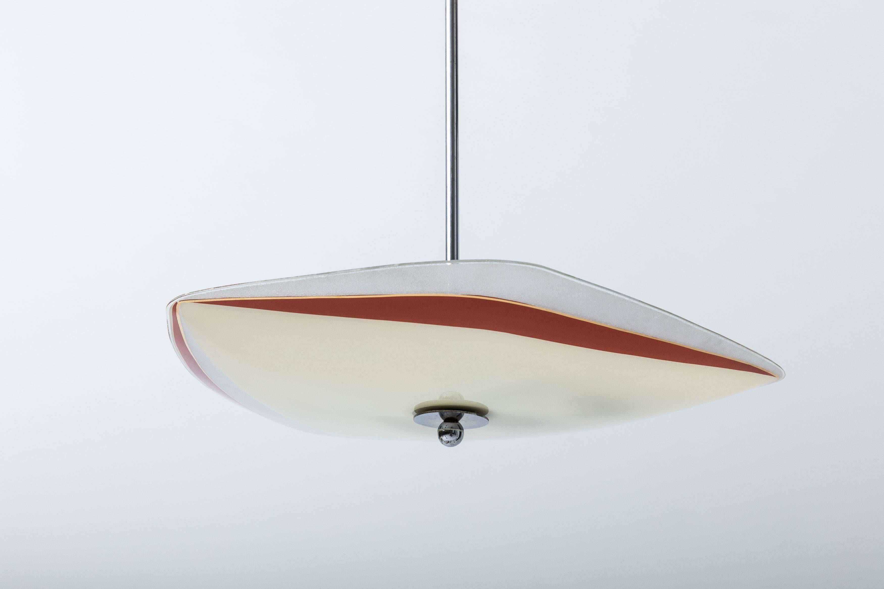 Ceiling light made from painted glass in an excellent condition.

This pendant light is suitable for E27 Edison Screw (ES) light bulbs for Europe and E26 ES universal line-voltage light bulbs for the USA.