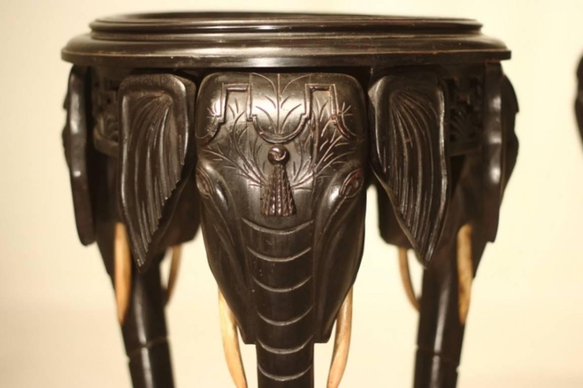 Pair of 1930s carved Ceylonese elephant side tables or jardinière stands.

         
