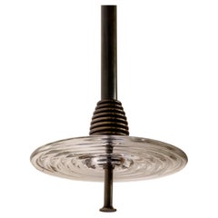 The Insulator 'D' Pendant in dark brass and clear glass by NOVOCASTRIAN