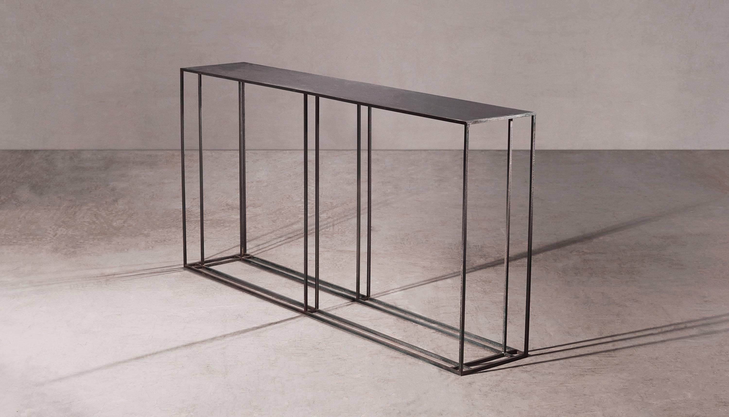 A console table in all blackened steel. Hand crafted to order in the North. Bespoke finishes and sizes are available.

Measures:  180cm width x 35cm depth x 80cm height.
Custom finishes and sizes available upon request.

Made to order in 12