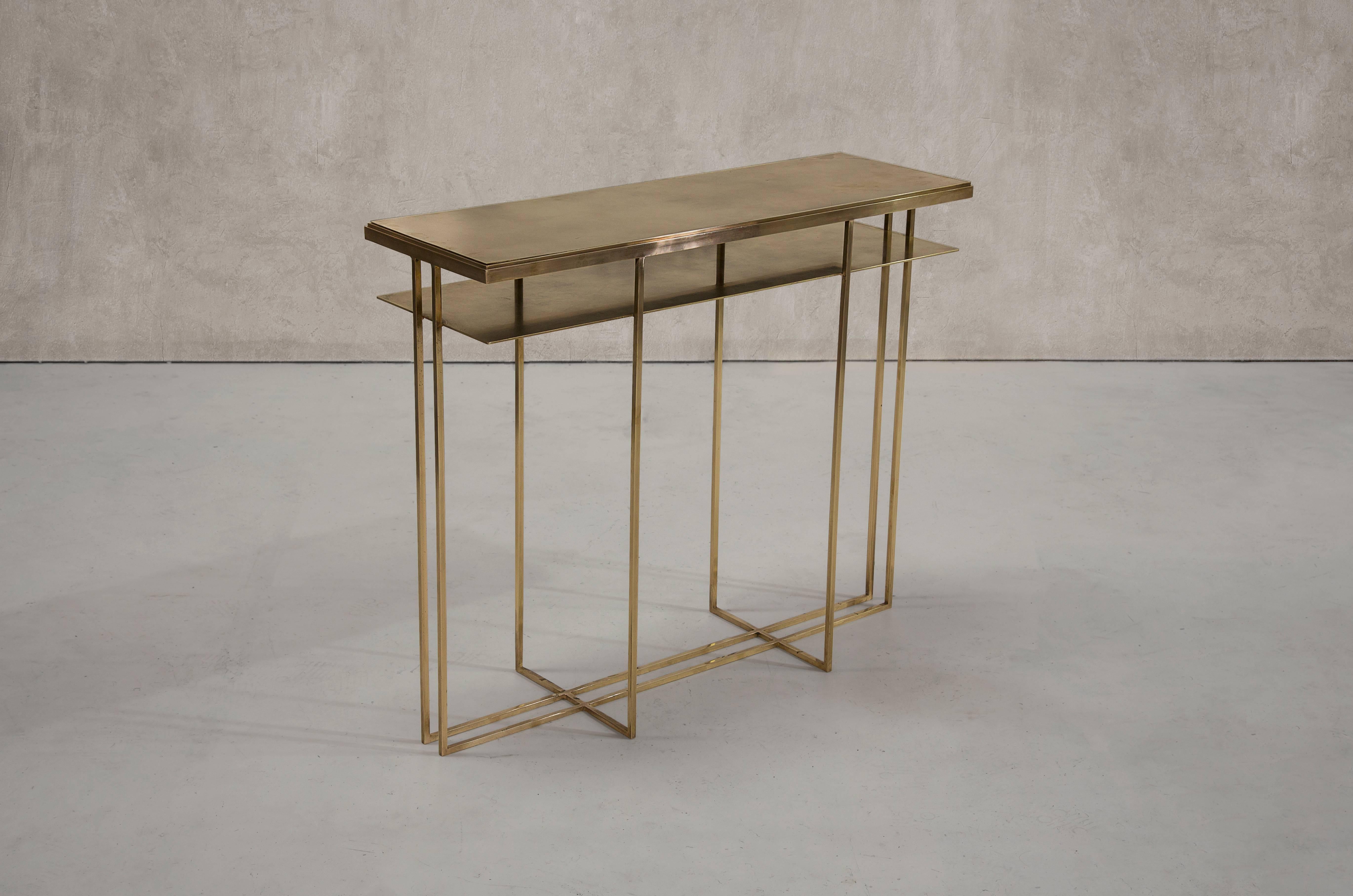 A console table in patinated brass. Hand crafted to order in the North. Bespoke finishes and sizes are available.

Measures: 120cm (length) x 25cm (width) x 80cm (height). 
Custom sizes available.

Made to order in 12 weeks.
Price excludes VAT.