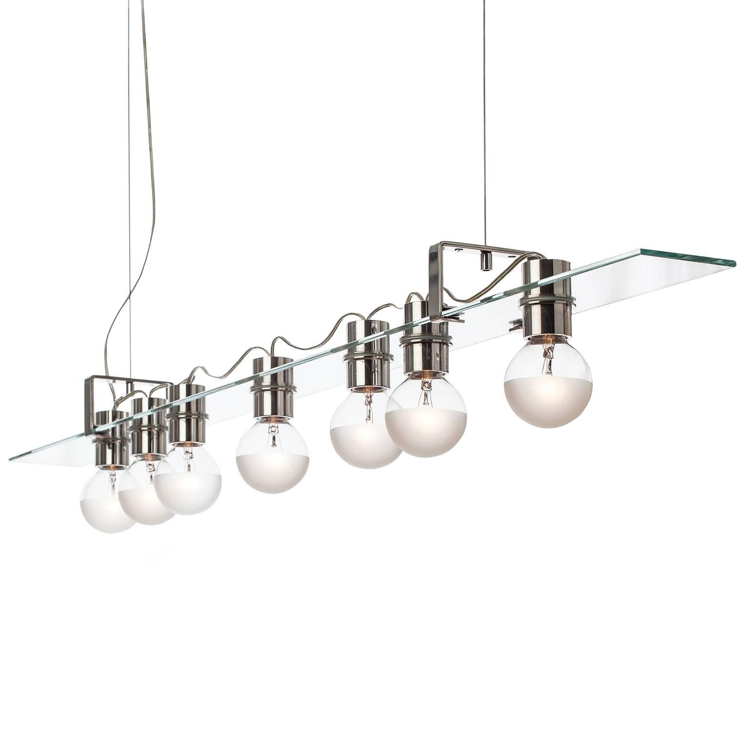 The float pendant features a glass panel held by two sets of interlocking aluminium brackets suspended from stainless steel cables. 

AVRAM RUSU STUDIO is a Brooklyn based design studio known for impeccably crafted and distinctly sculptural work.