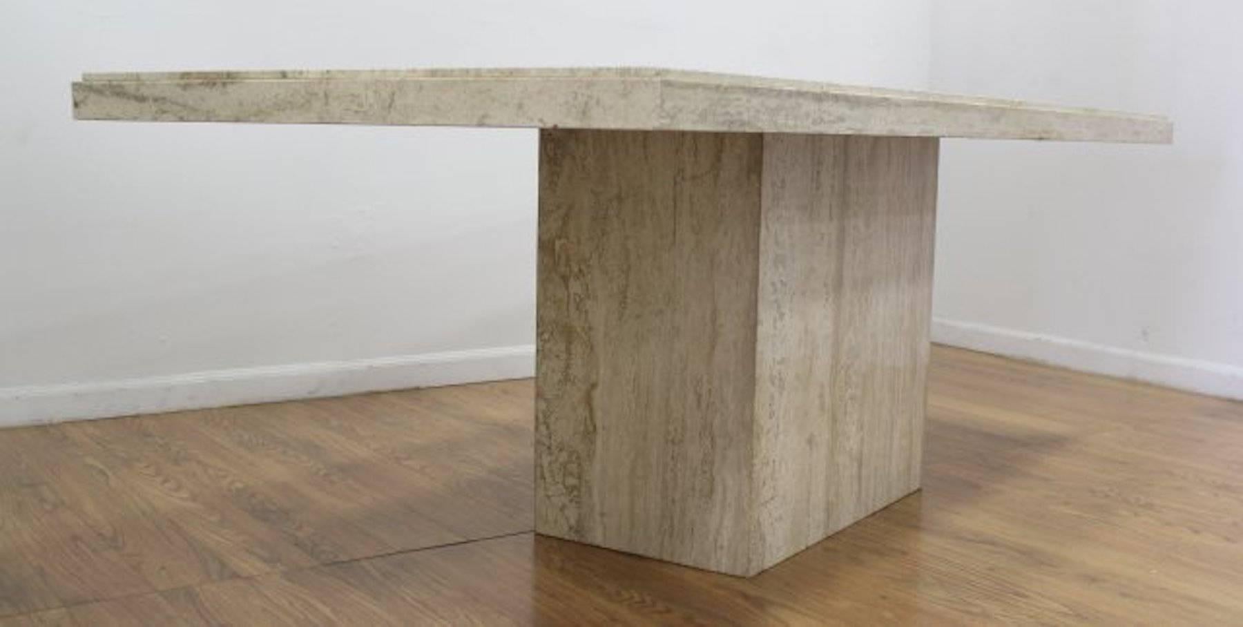 1970s travertine dining room table, of rectangular form beautiful variegated stone, raised on conforming monolith base. In two pieces.
