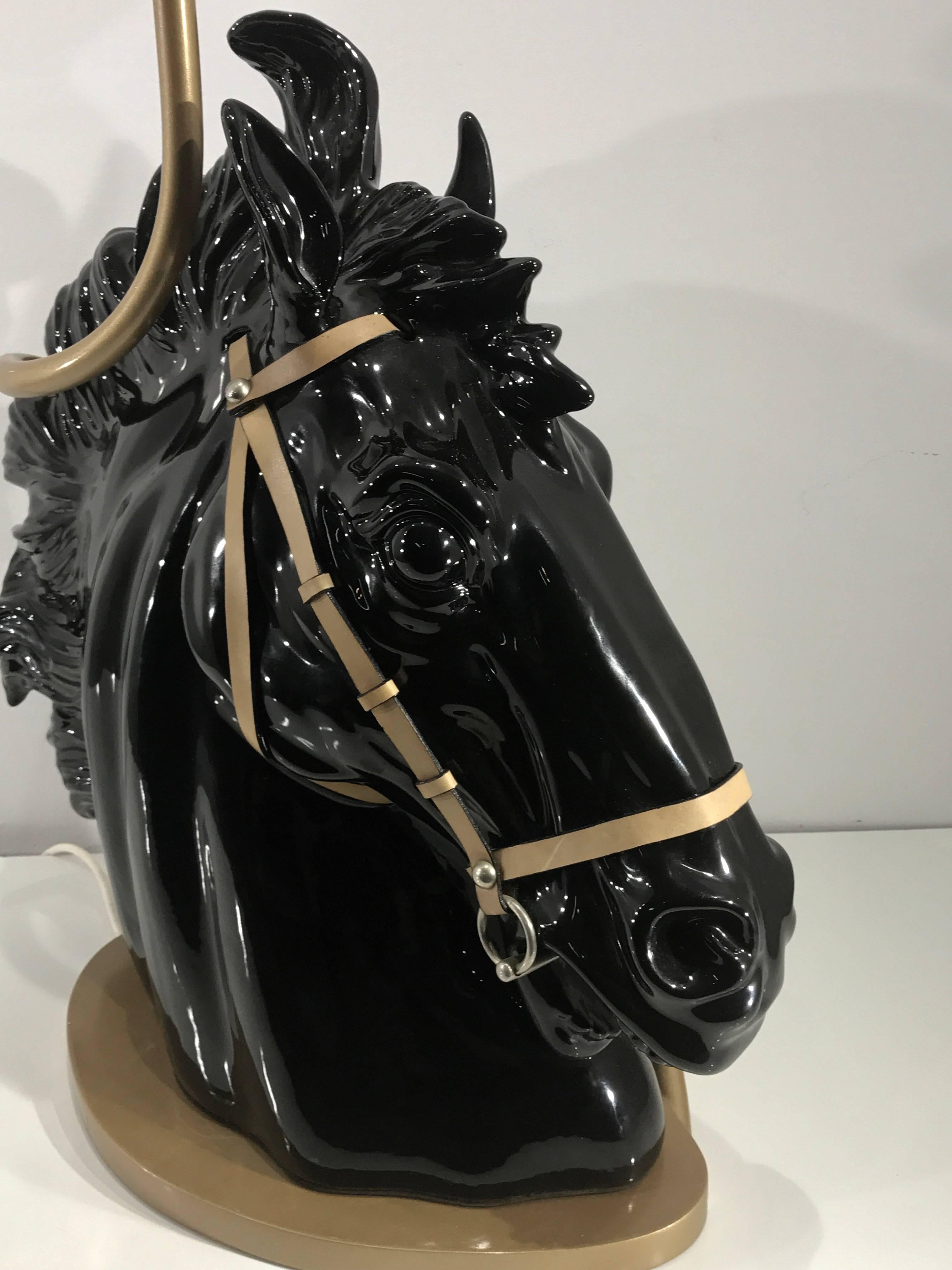Large Gucci horse head sculpture, as a lamp, the realistically modeled porcelain headed fitted with leather and metal briddle. Signed on the inset leather base. Resting on the signed Gucci designed and made lamp base.
As pictured as a lamp, 39.5
