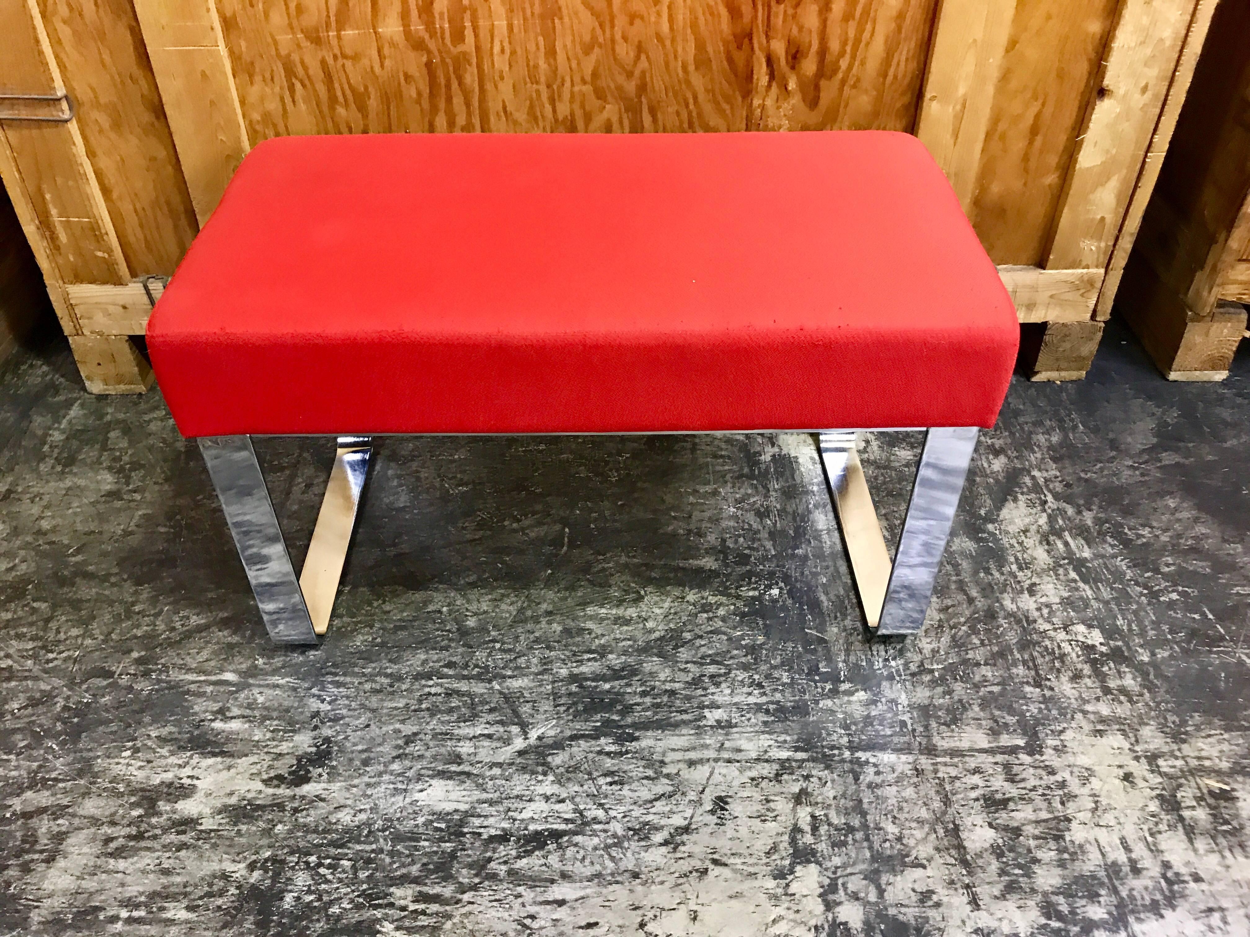 Classic Milo Baughman chrome bench, of rectangular form, vintage red upholstered top shows signs of wear, ready for re-upholstery in the fabric of your choice. Raised on a heavy duty bright chrome frame.