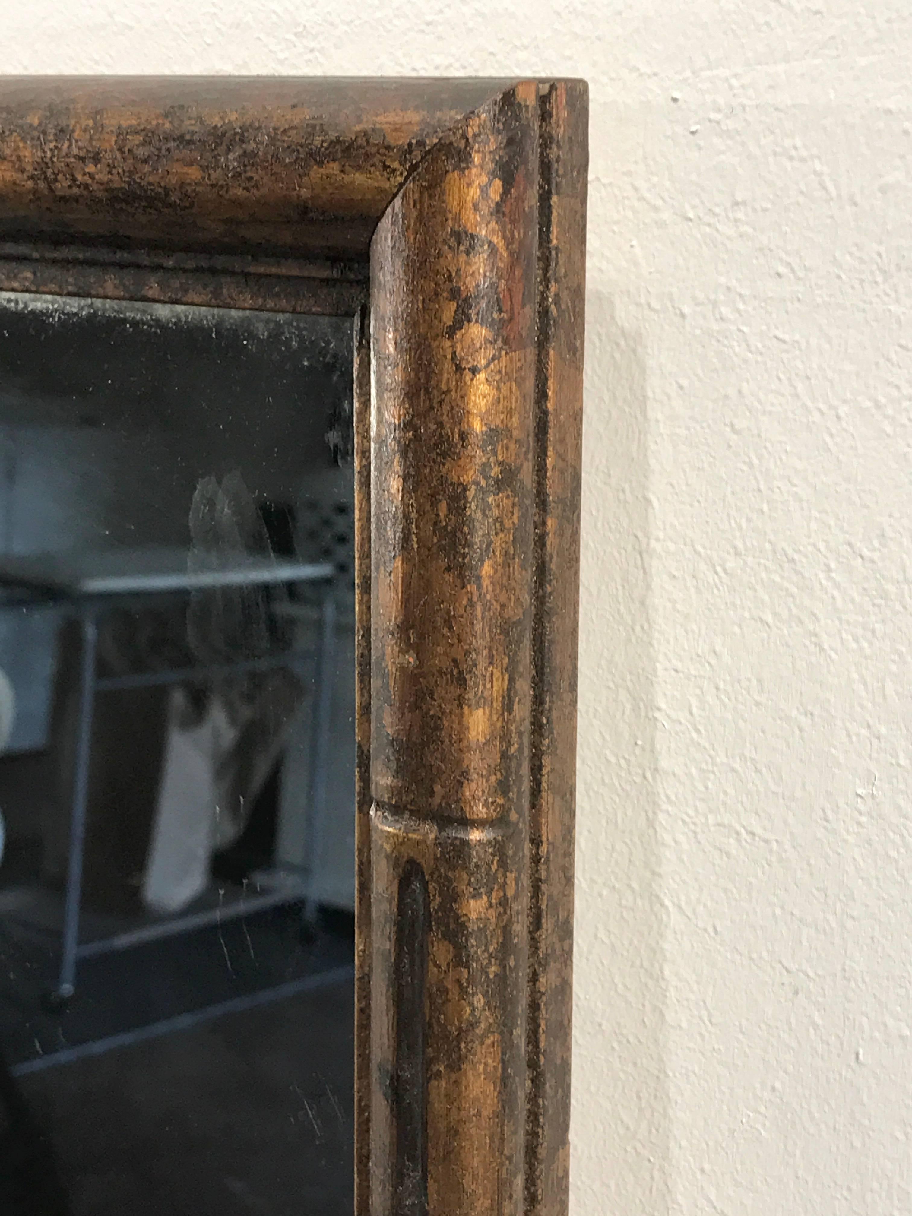 Midcentury faux bamboo acid washed wood trellis mirror, of rectangular form with the three surround mirrors, intentionally antiqued/distressed, the interior mirror 13"x 35" is clear.
