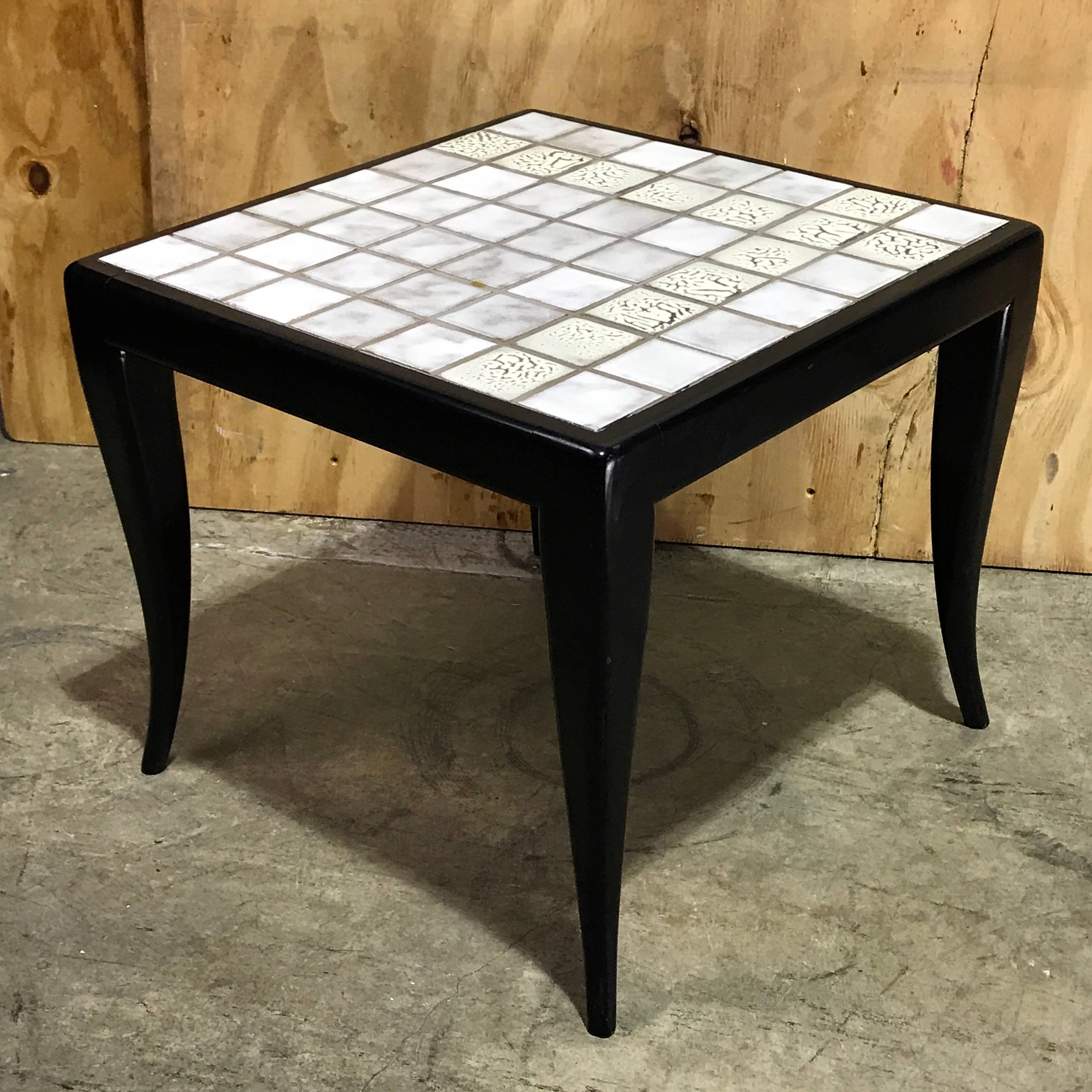 Italian midcentury white tiled side table, with 49 inset smooth and lava white glazed tile top table on a Robsjohn-Gibbons style ebonized base, marked with a paper label 