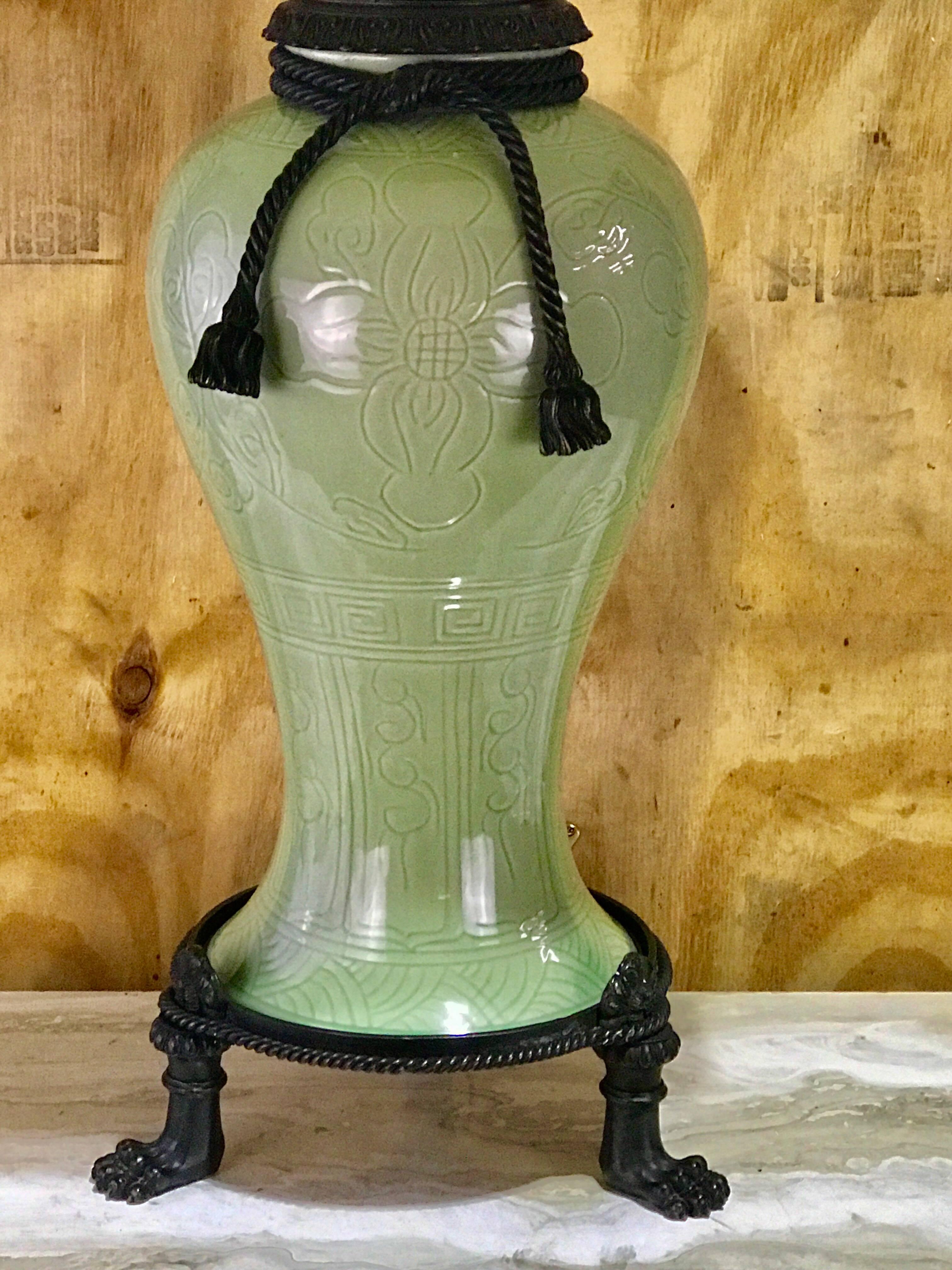 Large pair of Chinese Celadon bronze-mounted lamps, each one with intertwined bronze tassel mounts on a green incised decorated 10