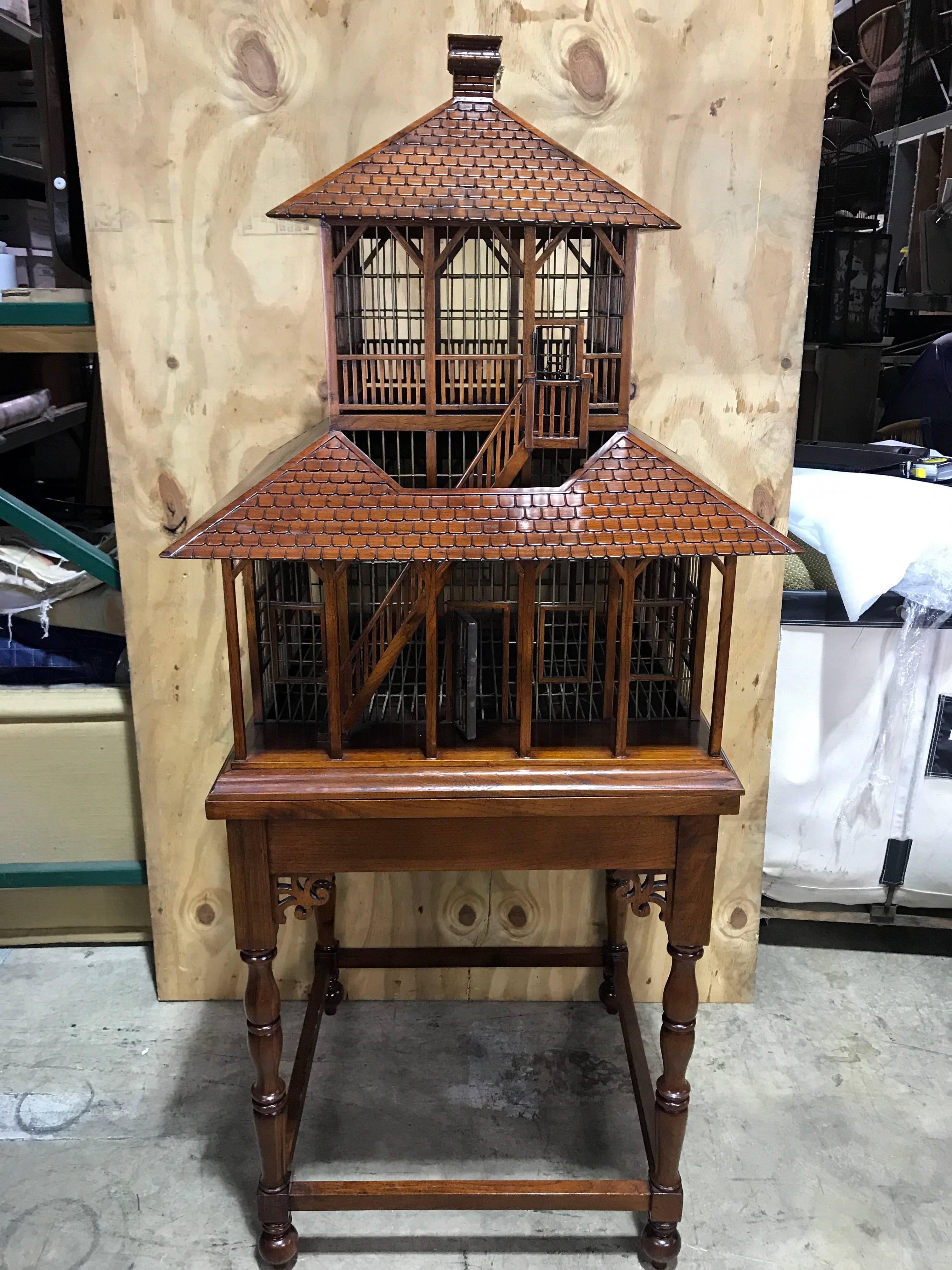 Carved mahogany grand antebellum style bird house on stand. Of carved mahogany and metal doors and windows. The quality and attention to detail is impressive of this architectural model- bird house. Complete with a removable Chimneyed 2nd story