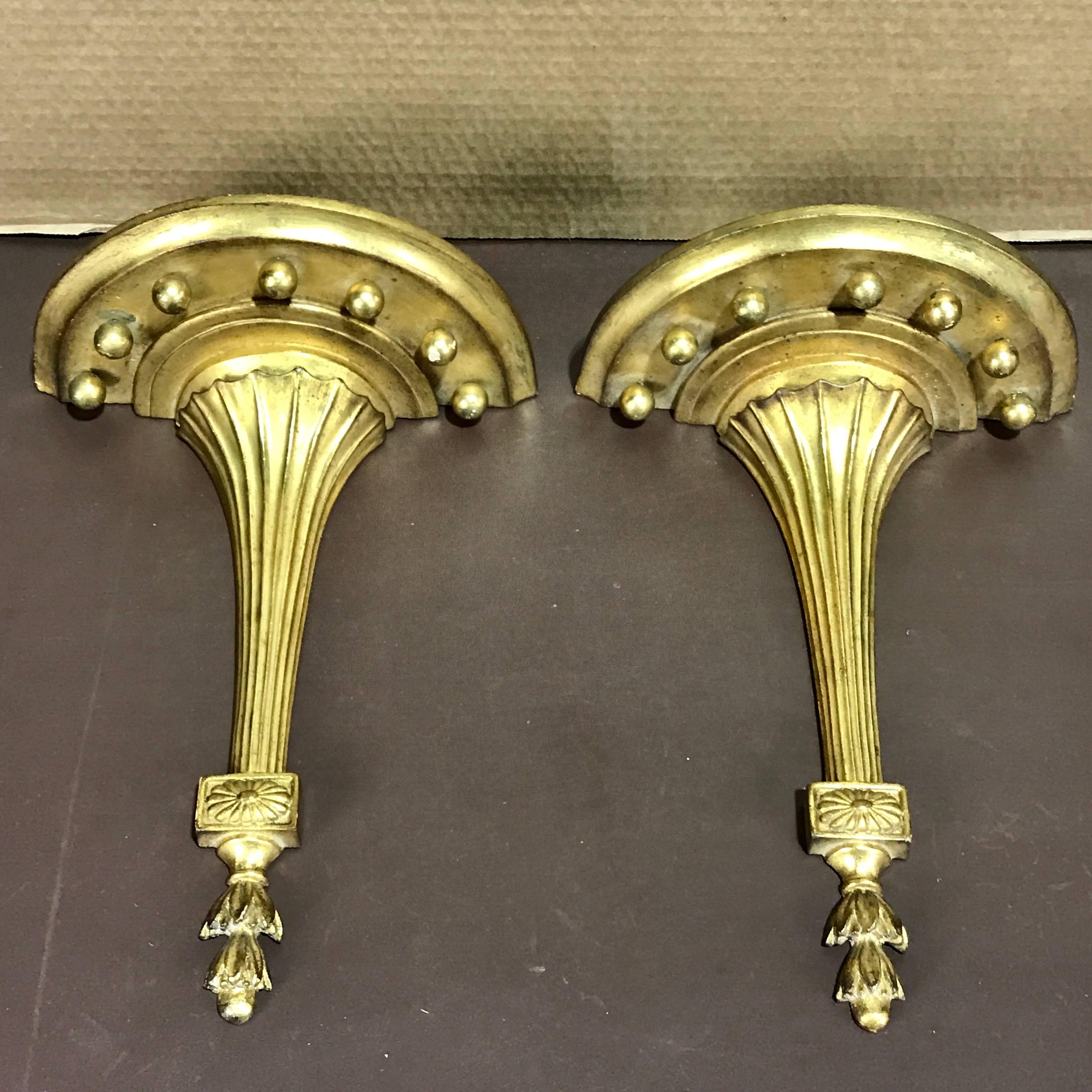 Pair of tall and sleek neoclassical gilt wall brackets, by Borghese
The Demilune shelf measures 10.5