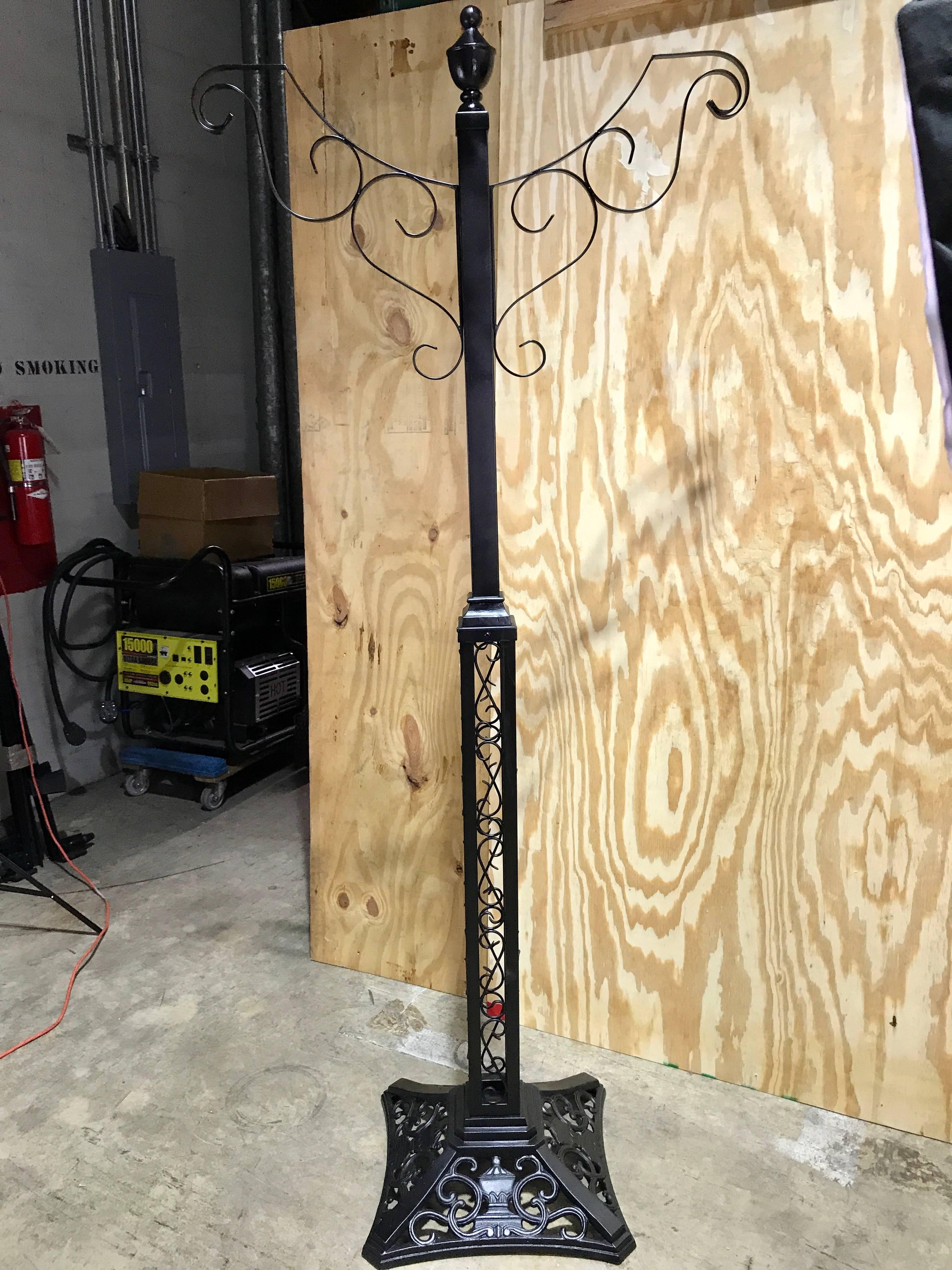 Victorian style wrought iron lamp post hanging planter, from Walt Disney World, Orlando. Standing 86
