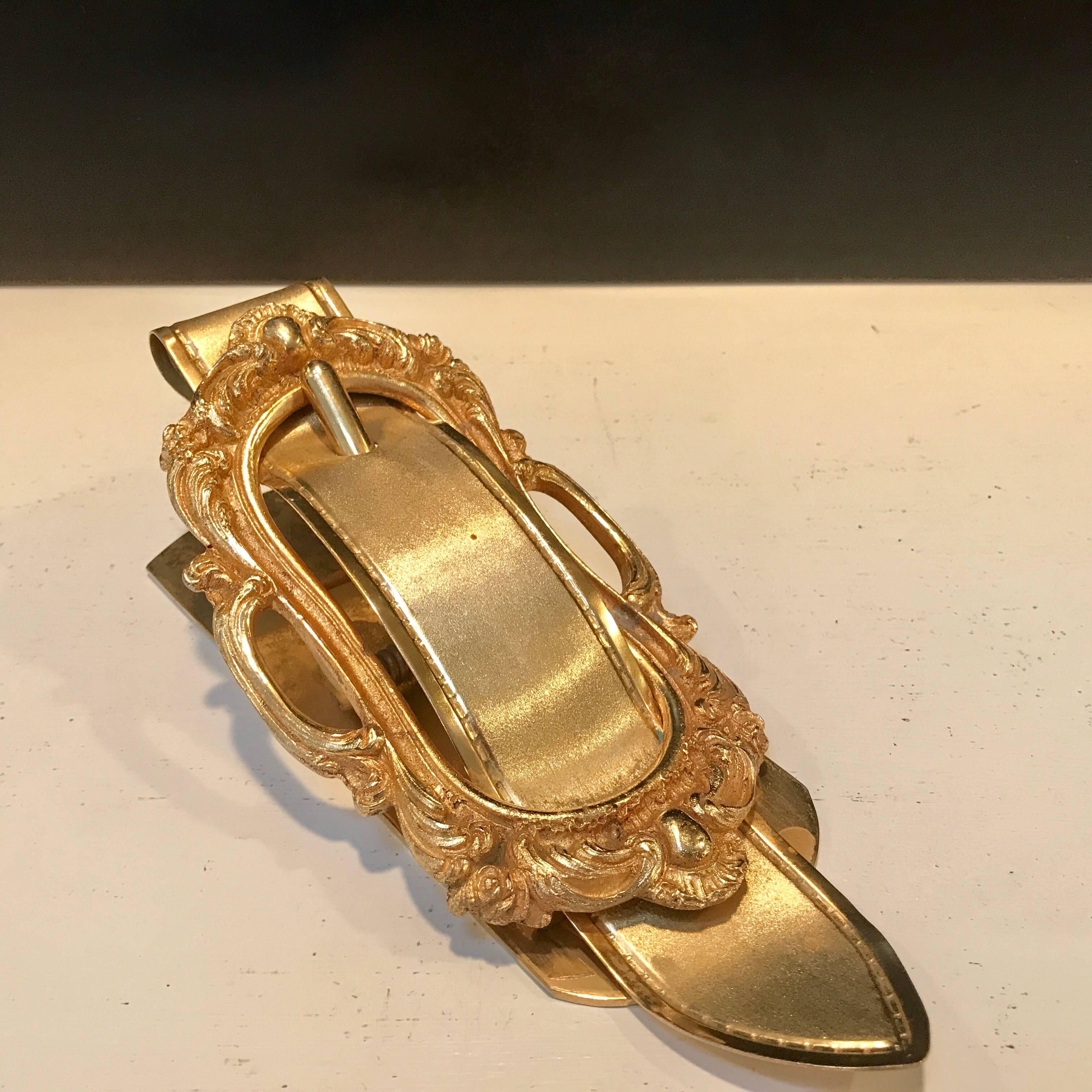 Italian gilt bronze buckle motif desk clip, in the style of Gucci, retailed by Saks Fifth Avenue.