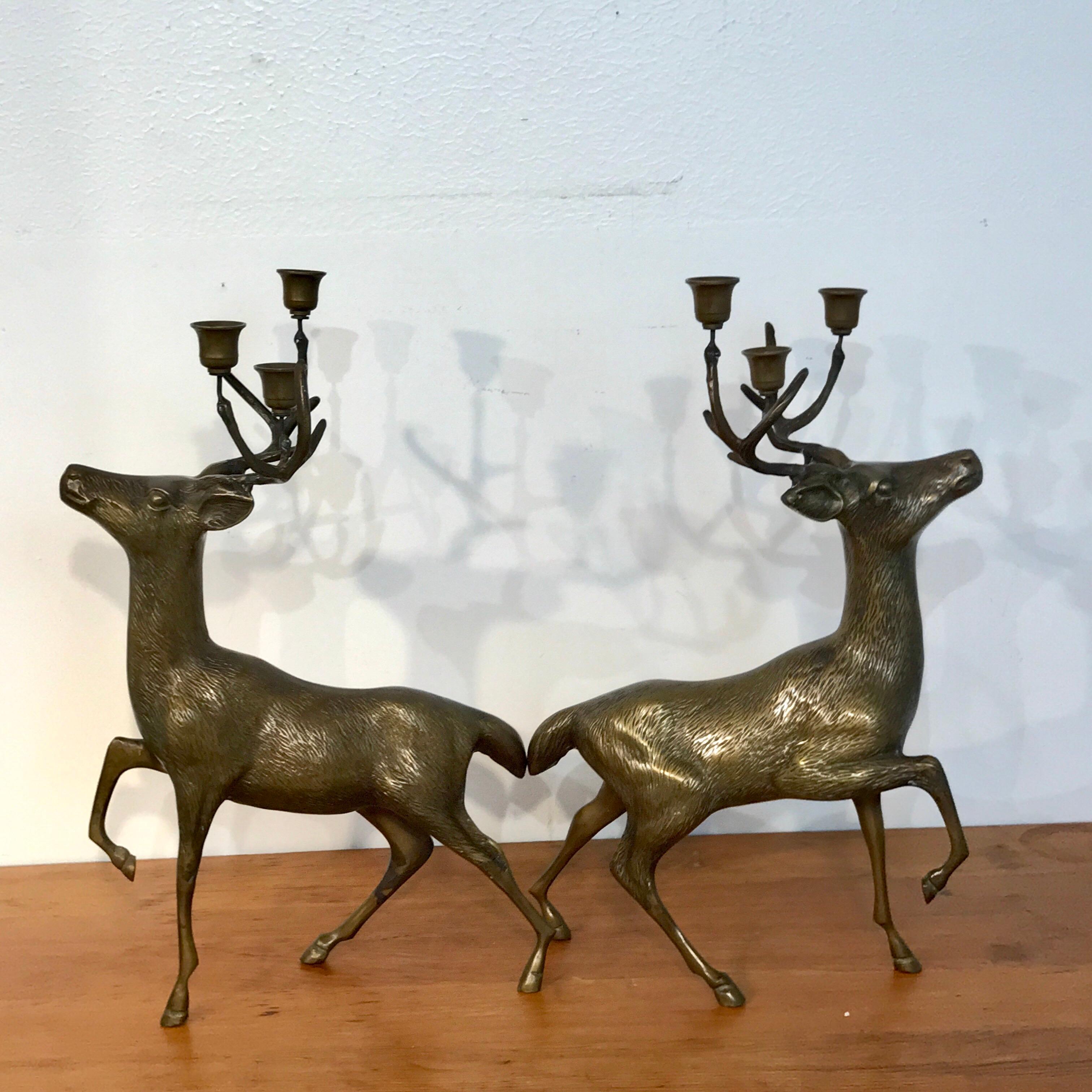 Pair of midcentury Sarreid bronze standing deer candelabra, each one fitted with three removable bobeches. Unmarked.