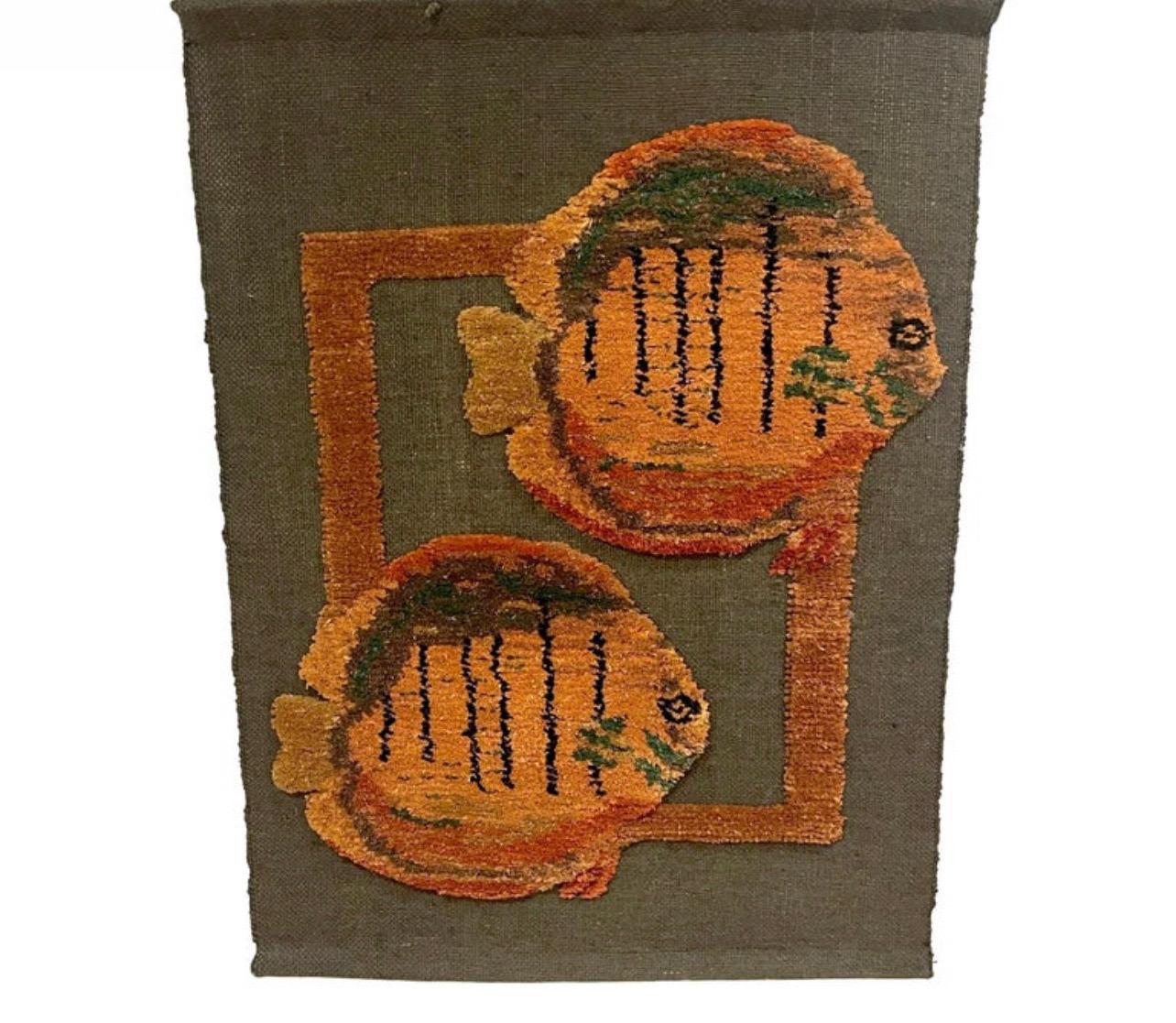 Mid Century Woven Fish Motif Tapestry by Tom Taylor, 1990
USA, 1990
This mid-century woven tapestry by Tom Taylor, created in 1990, is a great piece of fiber art from the later 20th century. It features a sleek dual fish motif and is made using