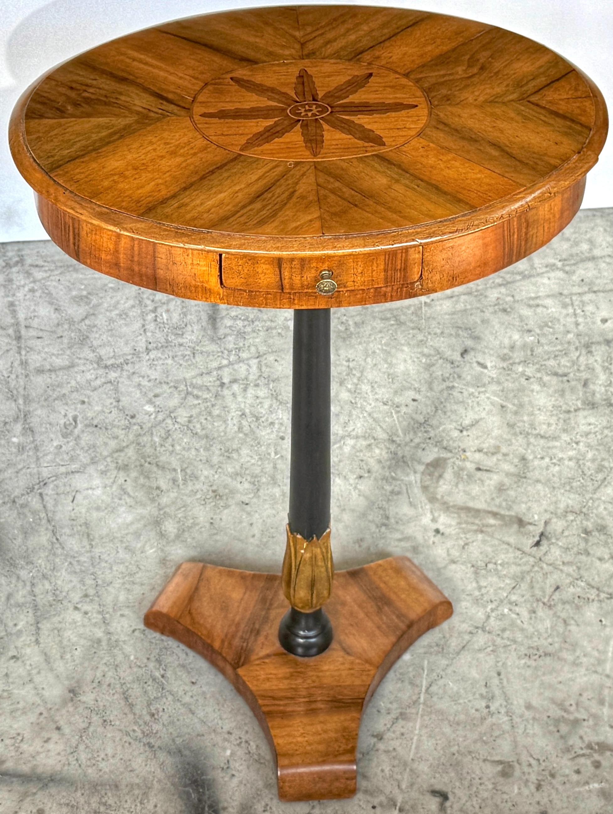 Biedermeier Inlaid Fruitwood, Satinwood & Yew Side Table with Ebonized Pedestal Side Table, Mid -19th Century

A refined 19th-century Biedermeier pedestal side table, masterfully constructed in fruitwood, satinwood, and yew, featuring a richly