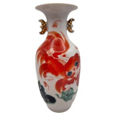 Chinese Porcelain Guardian Lion Vase with Calligraphy and Gilt Bat Handles
