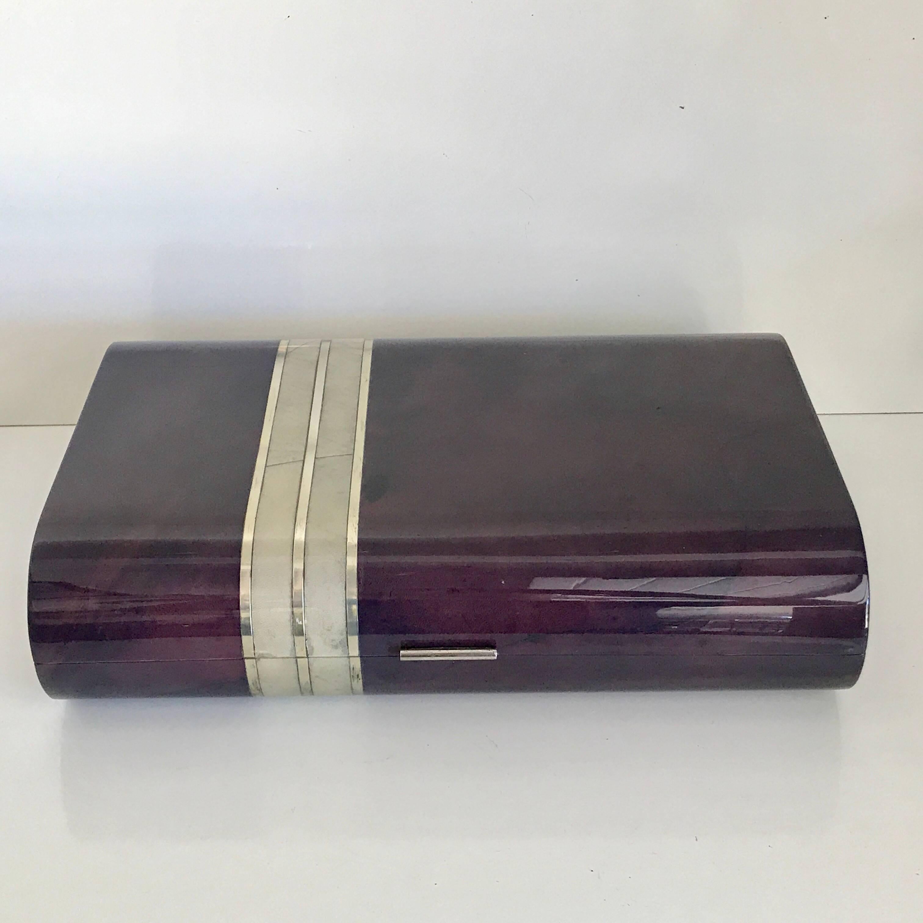 Huge signed Enrique Garcel amethyst goatskin and silver inlaid bone table box, with a lacquered wood interior.
Excellent vintage condition, not new, some signs of use and wear are apparent, anything significant would be noted/pictured. There are