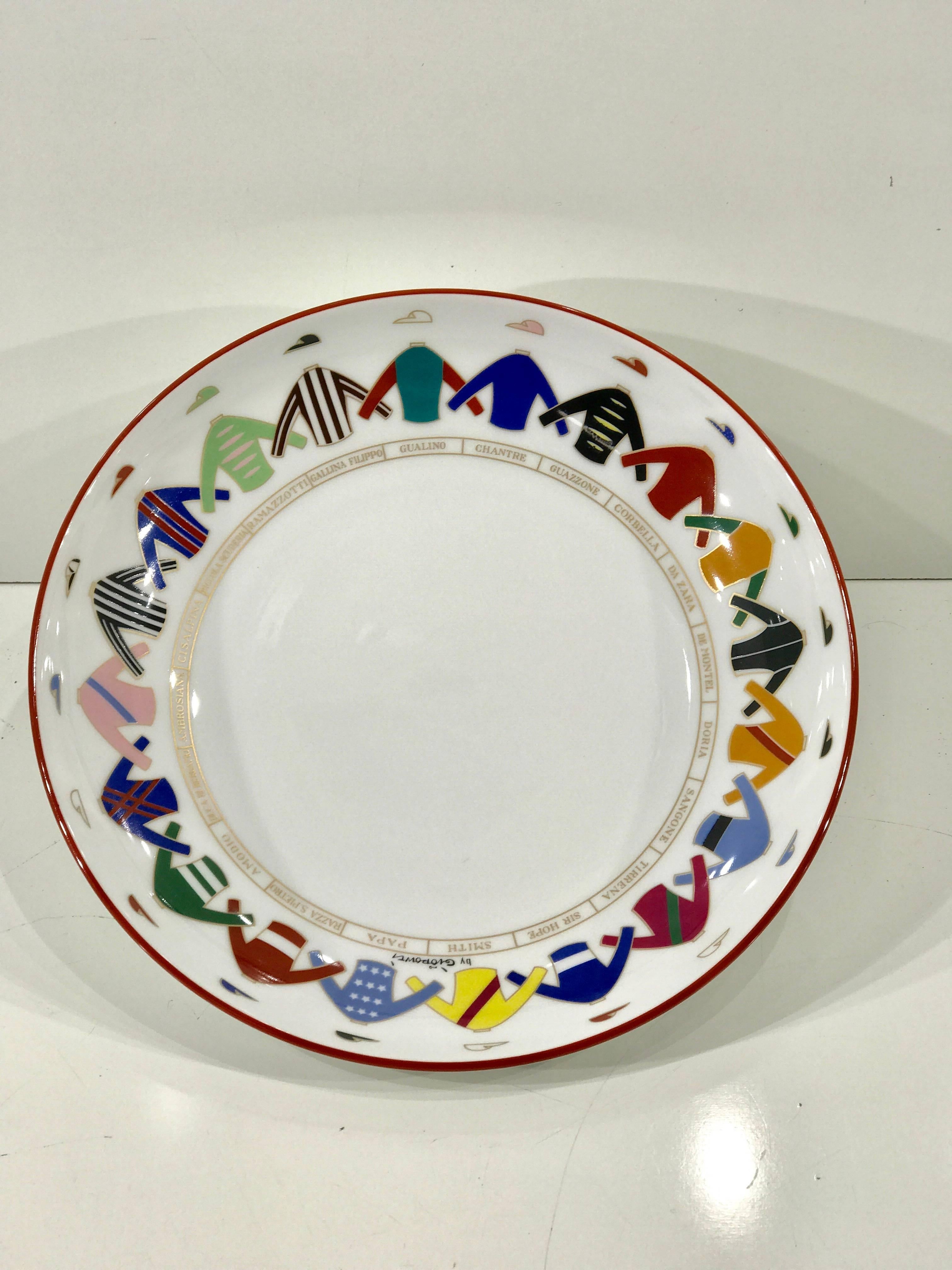 Pair of Gio Ponti jockey motif plates/shallow bowls for Richard Ginori, decorated with a continuous border of 20 different Jockey silks and uniforms.





    