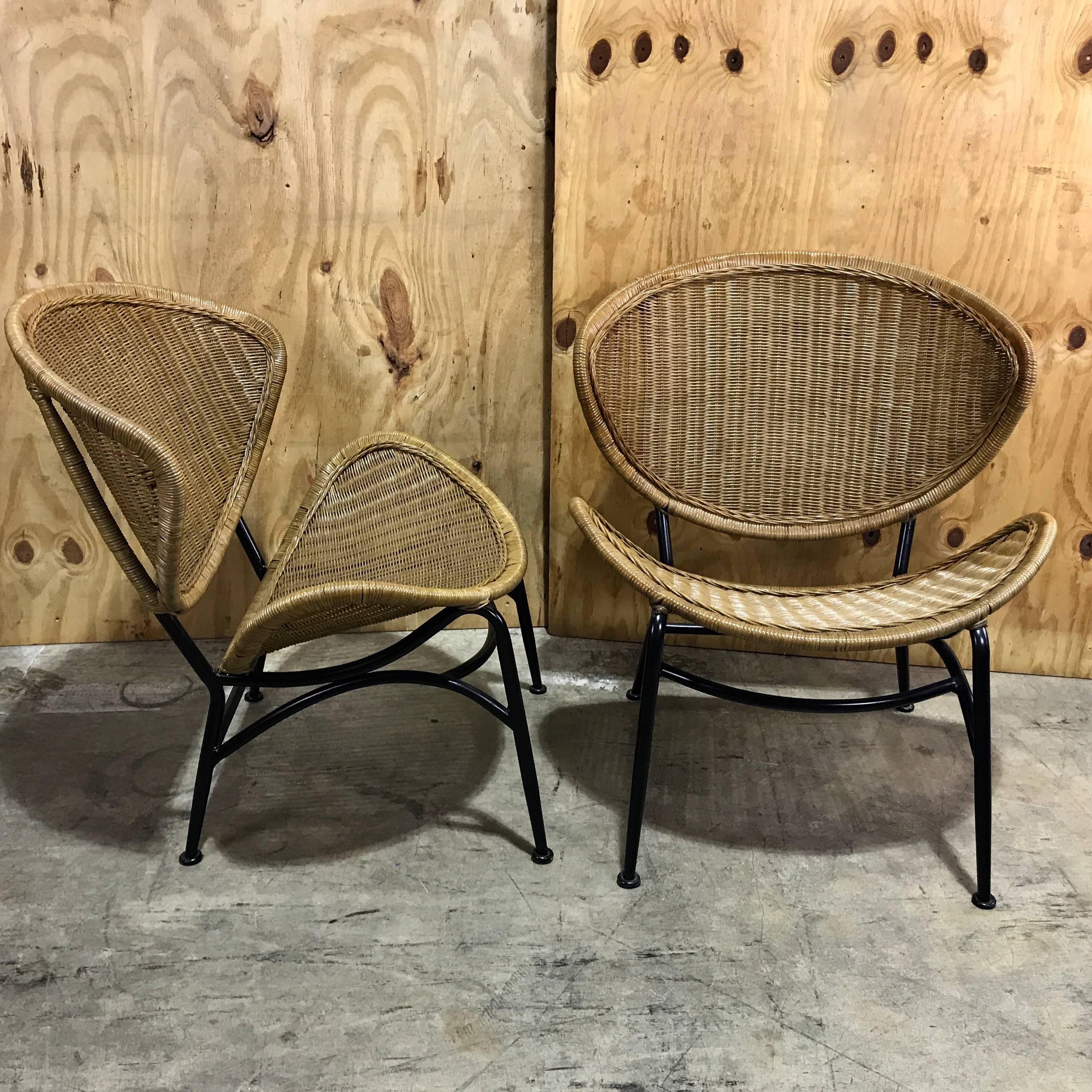 Pair of midcentury crescent shaped wicker lounge chairs, restored.