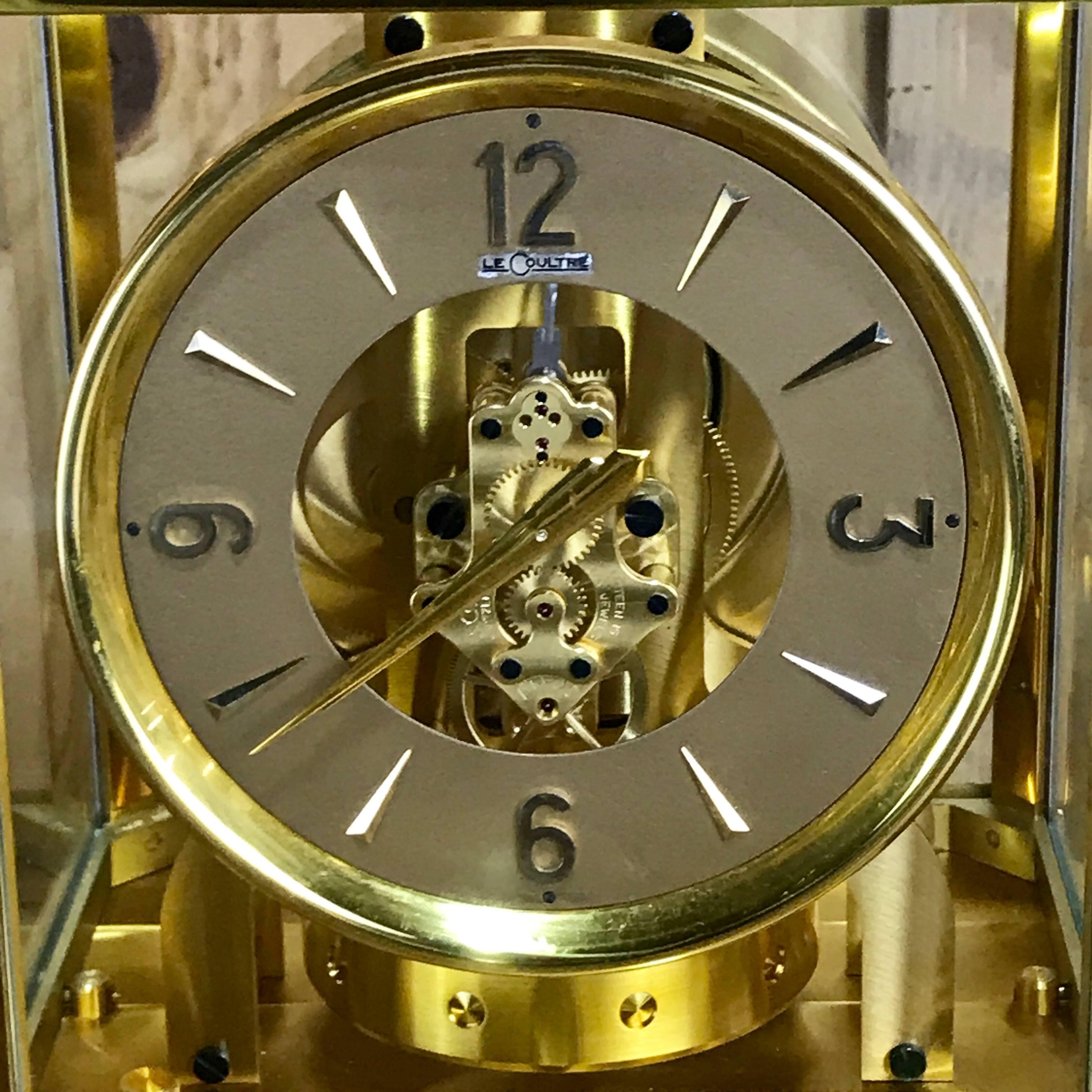 Midcentury LeCoultre gold atmos clock, iconic model, gold-plated skeleton case, with circular dial.




         