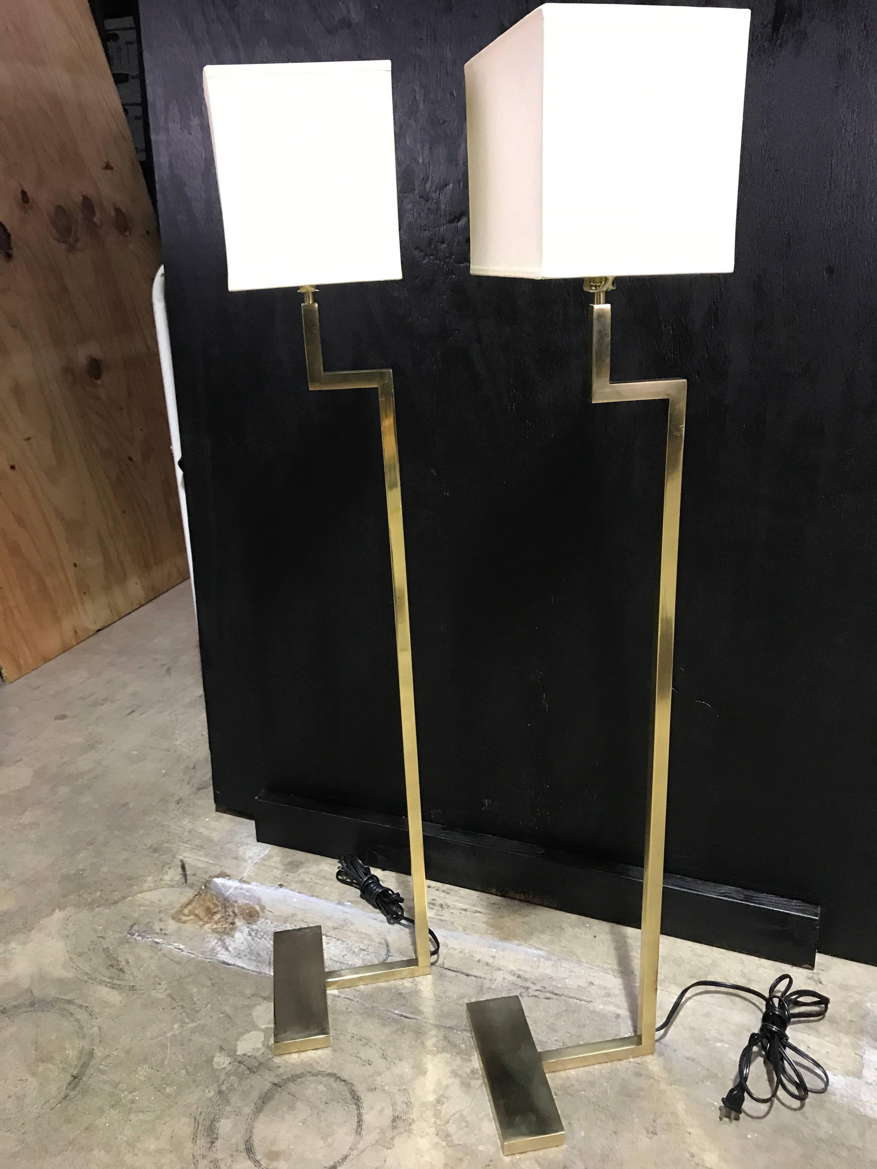 Pair of French modern brass floor lamps by Jacques Quinet
literature, Jacques Quinet, G. Maldonado, similar examples illustrated.
 