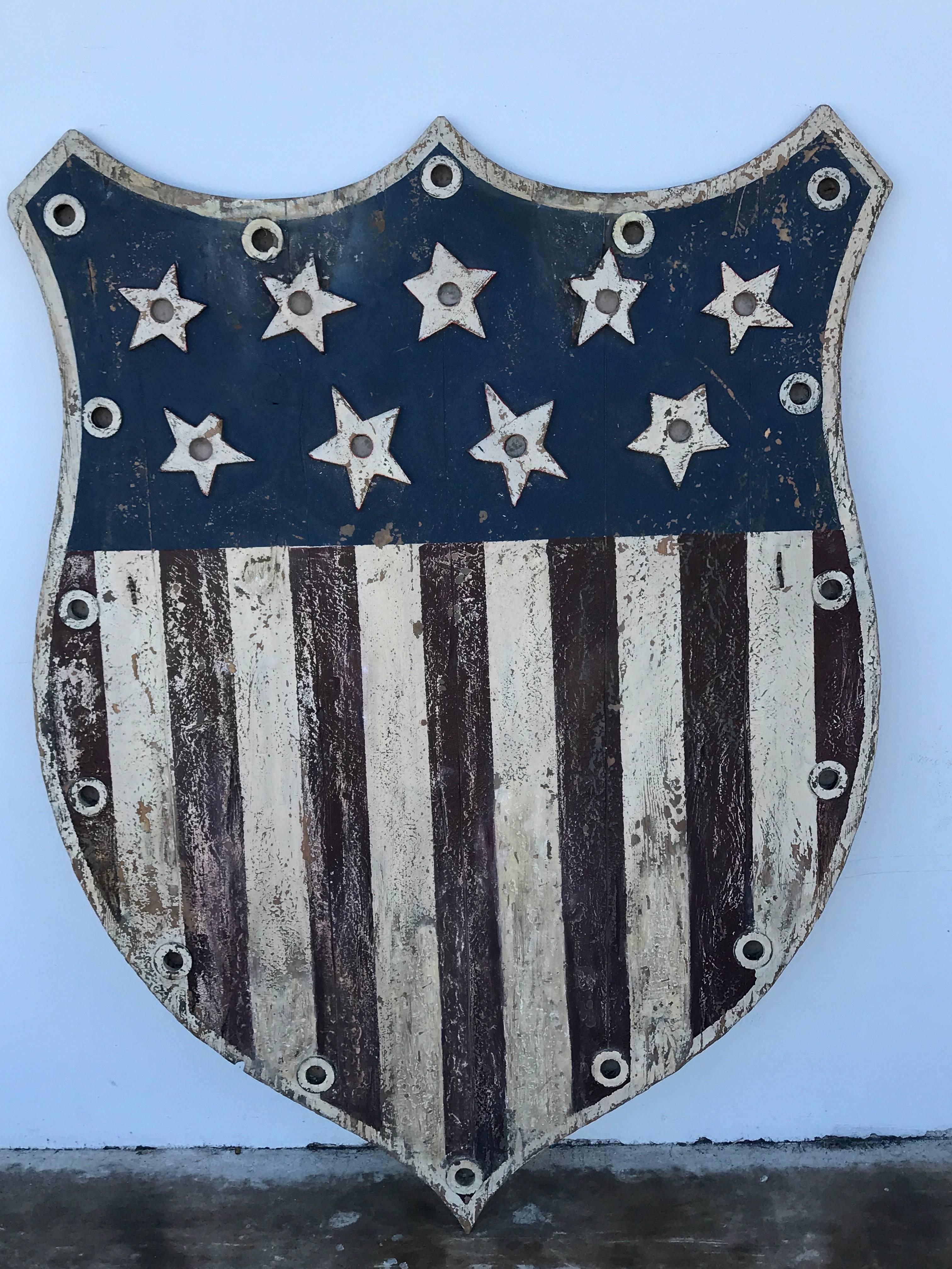 American Folk Art flag shield or sign with nine stars, a variation of the stars and bars flag (May 21, 1861-July 2, 1861) nine stars representing South Carolina, Mississippi, Florida, Alabama, Georgia, Louisiana, Texas, Virginia and Arkansas
This