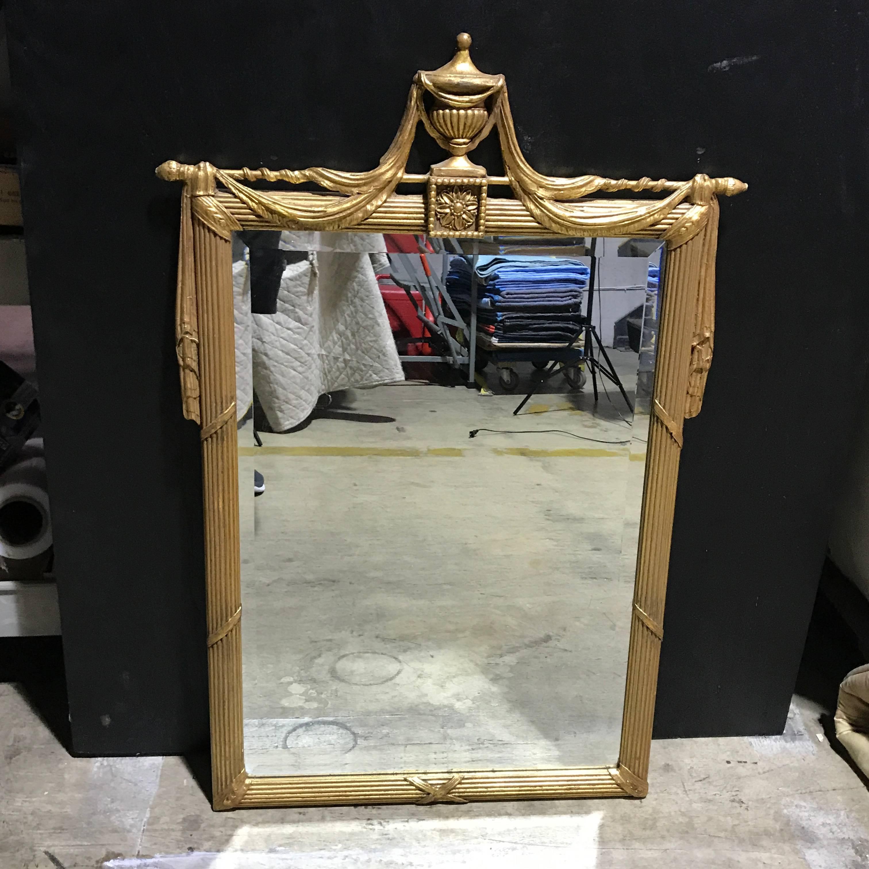 Giltwood neoclassical draped mirror, 28