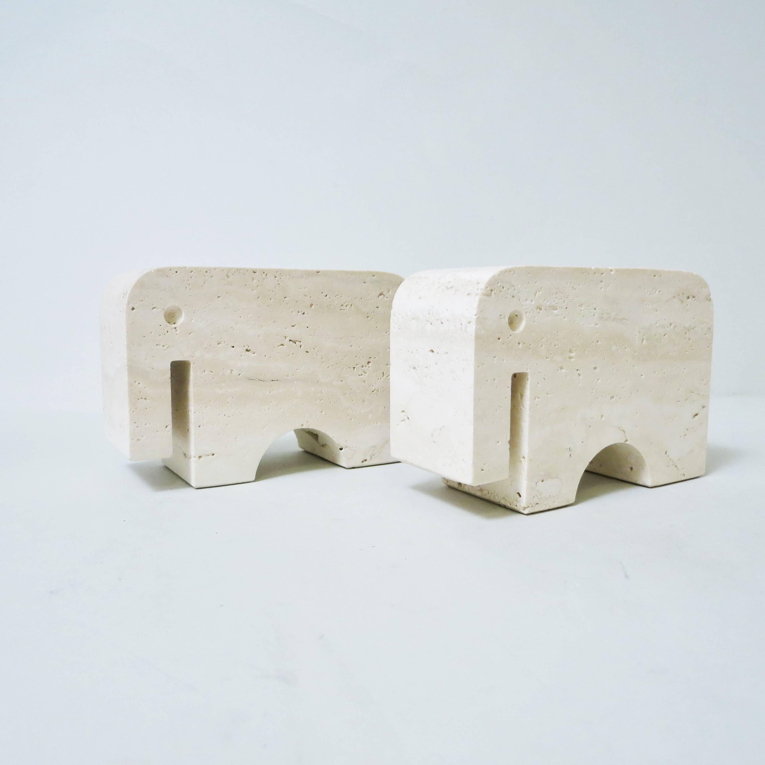 Pair of bookends elephant carved in a block of travertine from Rapolano designed and produced by Fratelli Mannelli in Signa, Italy, circa 1970. 
Labeled under each piece.