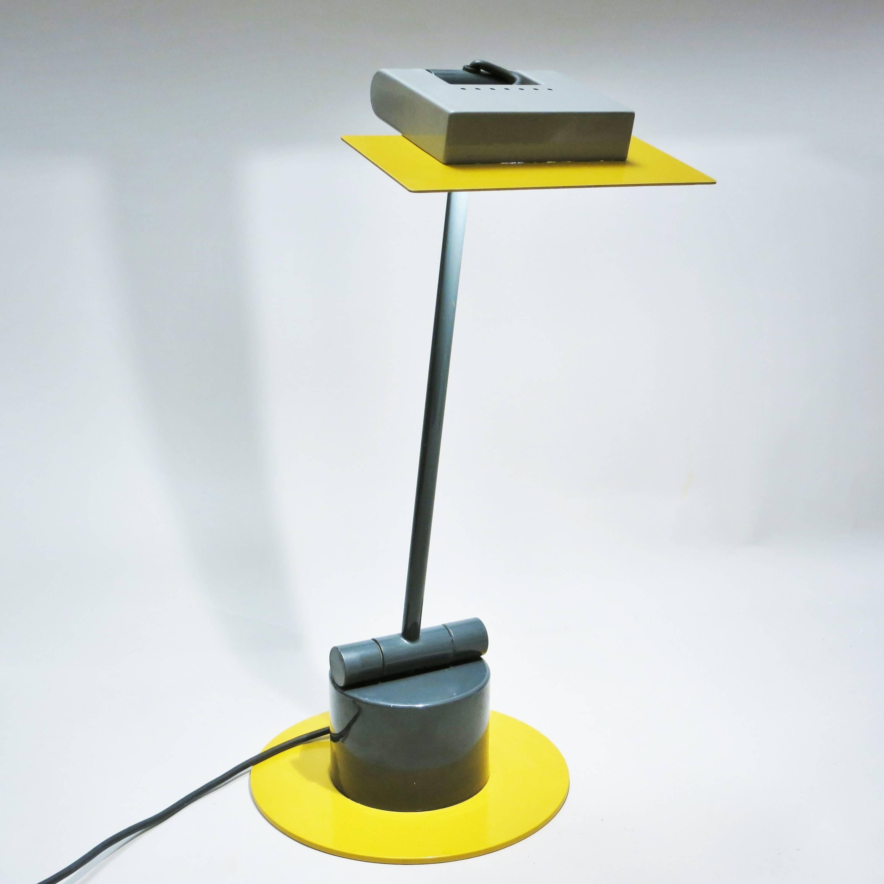 Post-modern desk lamp Aero designed by Ettore Sottsass for Bieffeplast in 1983, in dark grey, light grey and yellow lacquered metal. Orientable.