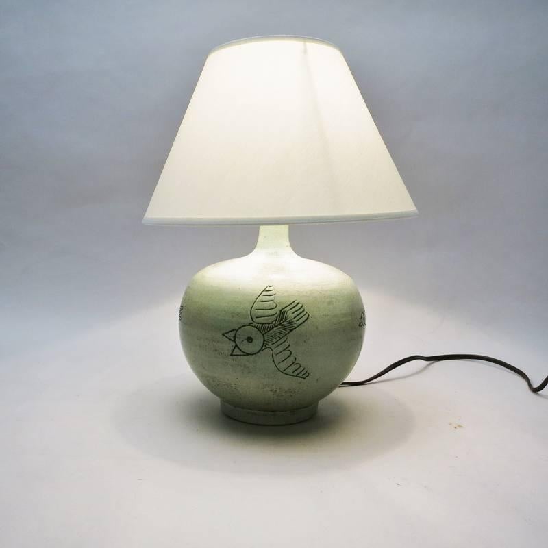 Ceramic lamp with birds decor by French ceramist Jacques Blin, circa 1950. Signed J. Blin under the base
H with shade: 32 cm.