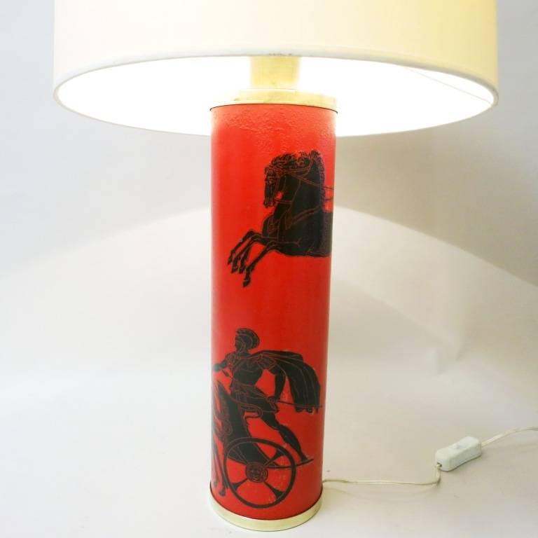 Red and black enameled metal lamp from the 1950s, displaying Greek warriors. Designed by Piero Fornasetti, Italy. The shade is not included.