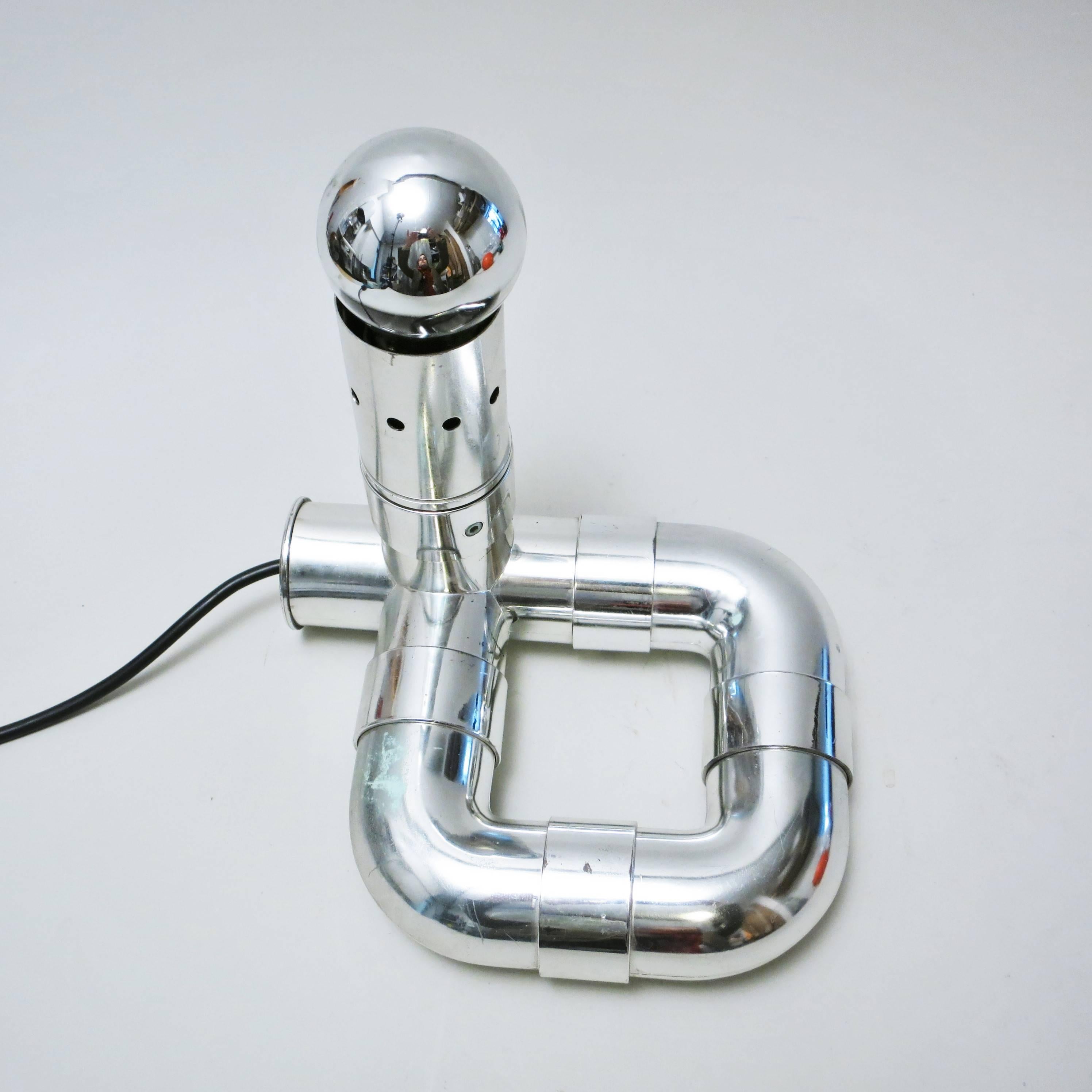 Lamp Rombo designed and produced by Gaetano Missaglia in Italy, circa 1965. It puts together chromed ABS plastic pipes in a radical and Futurist design.