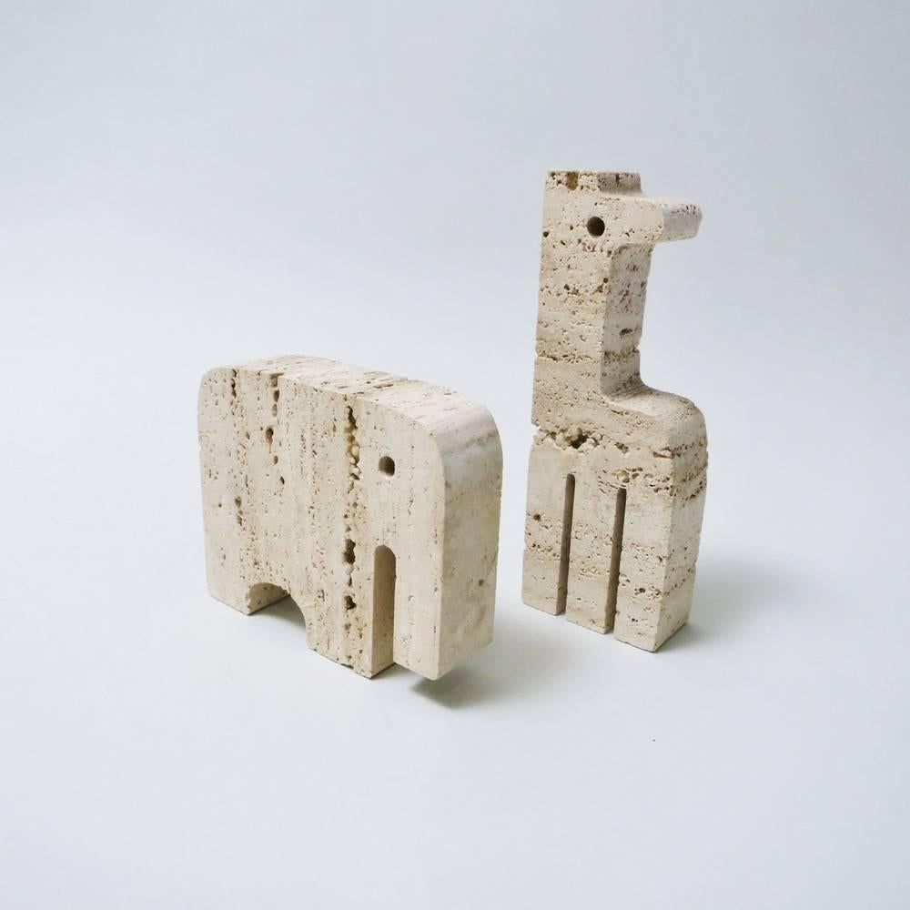 Set of two animals sculptures: elephant and giraffe made of travertine by Italian designers and makers Fratelli Mannelli, circa 1965. Measures: Elephant: 15 x 10 x 3 cm, / Giraffe: 17 x 8 x 3 cm
Labelled on the base.