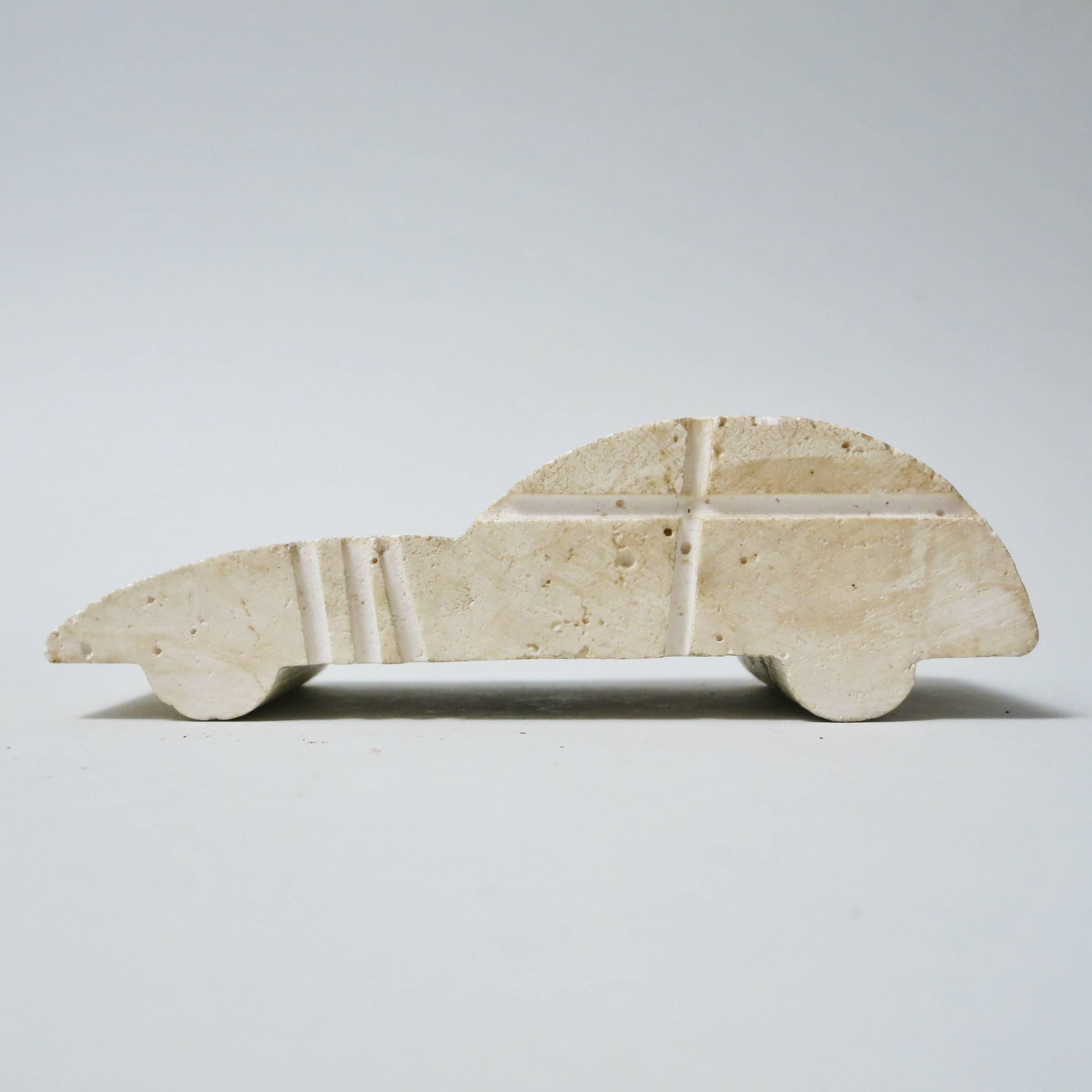 Italian sport car paperweight made and designed in travertine by Fratelli Mannelli in Italy, circa 1970.