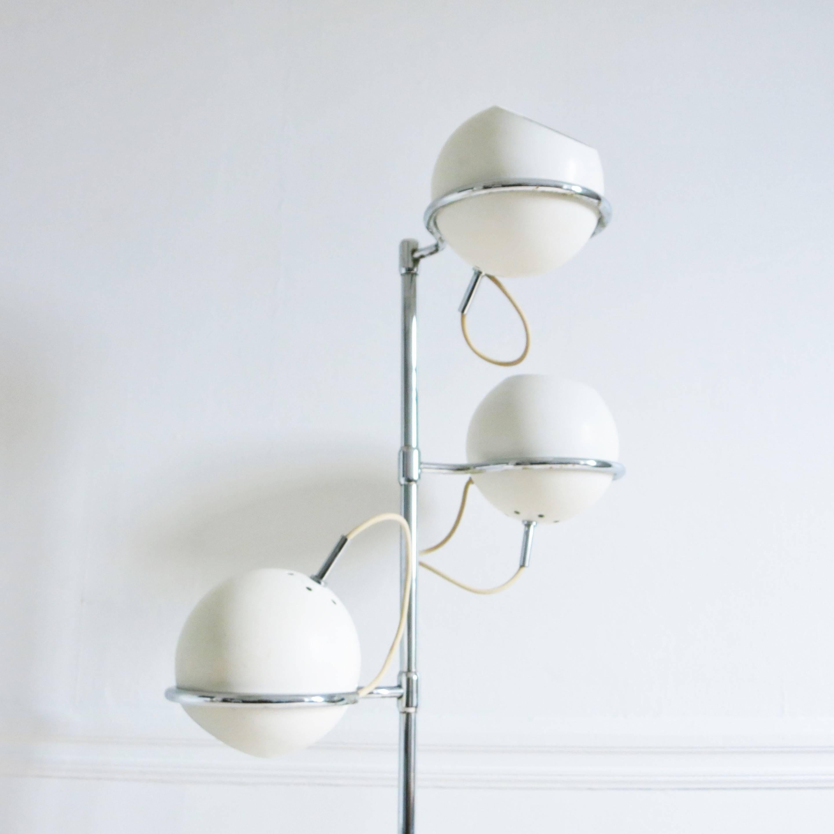 Floor lamp with three adjustable and rotable white laquered balls deigned by Etienne Fermigier for Monix, circa 1965. Rod and arms in chrome metal. 
Labelled 