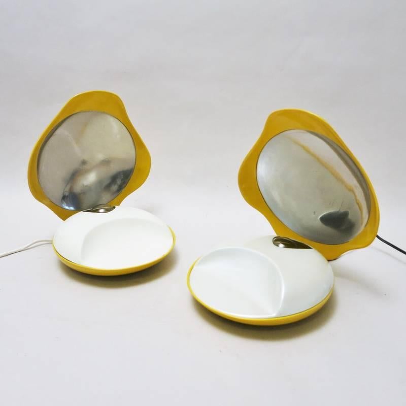 Pair of Space Age Italian Shef Lamps edited by Gamma 3. Shelves in yellow ABS plastic. Bulb is like a pearl under the white lacquered metal cap. The light reflects in the metallic parts. The top is adjustable. Both lamps are labelled Gamma 3 in