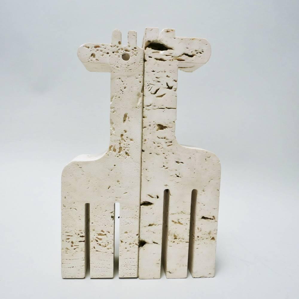 Pair of Giraffe bookends in travertine designed by Fratelli Mannelli in Signa, Italy, circa 1970. One is labelled under the base. This pair is lightly asymmetrical due to the stone cavity.