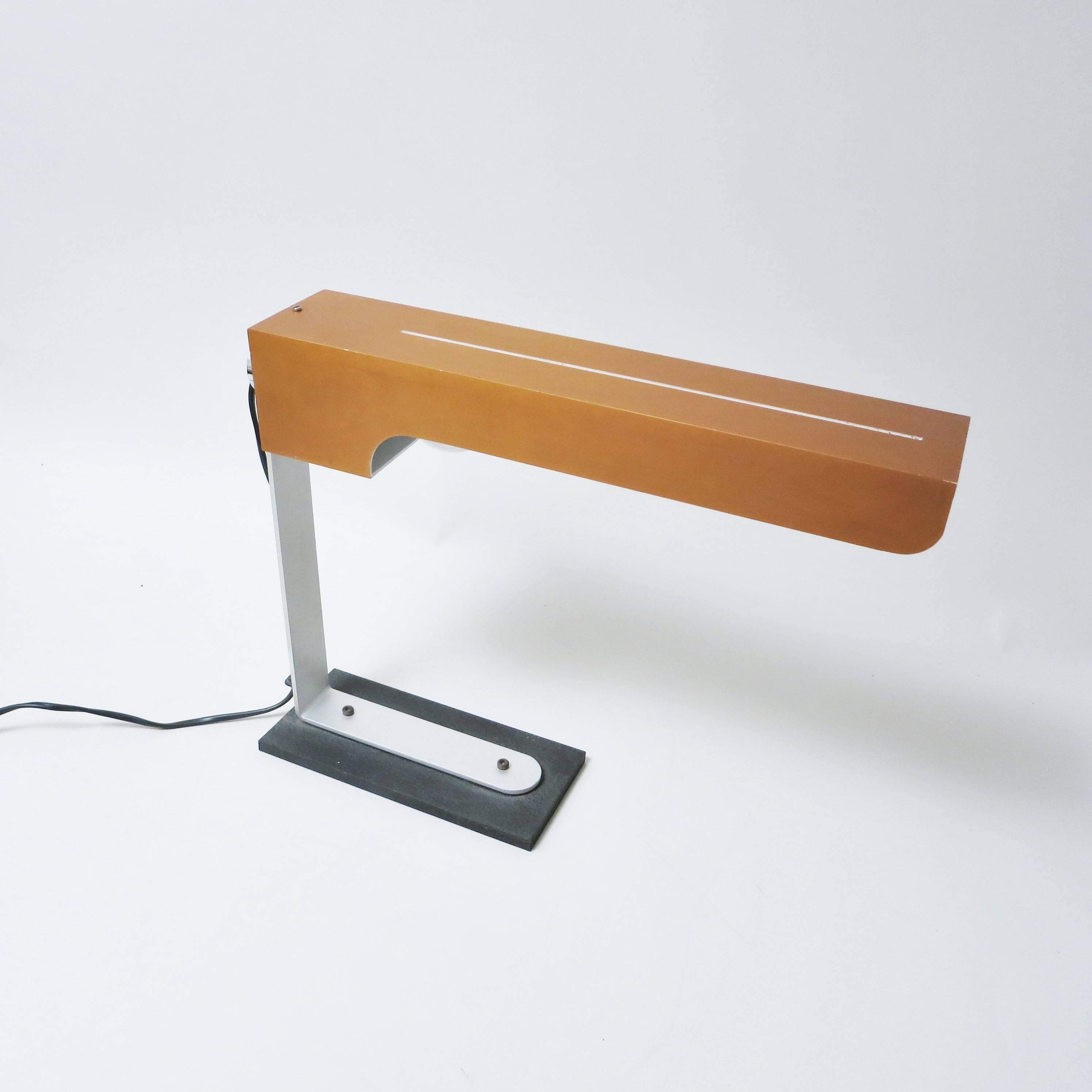 Rare Italian Mid-Century Modern desk lamp with a steel base, an aluminium arm and a large copper shade in the manner of Giancarlo Frattini, circa 1960.