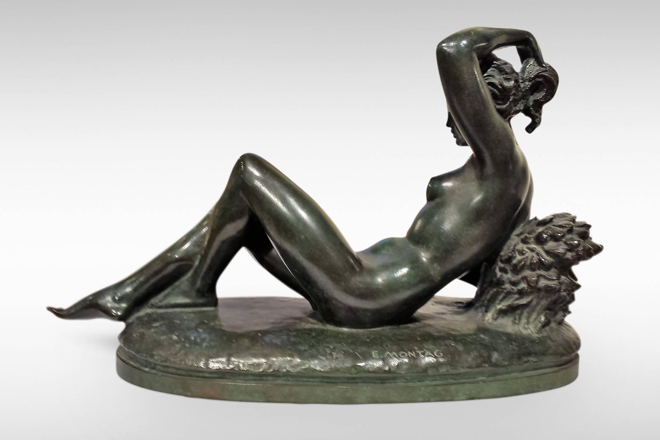 An Art Deco bronze sculpture by E Montage entitled 'Nu Couche'.
Signed to base.
circa 1925.
    