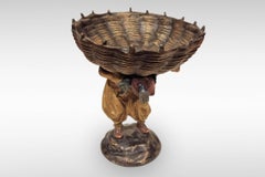 Boy Carrying a Basket a Bronze Sculpture by Franz Bergman