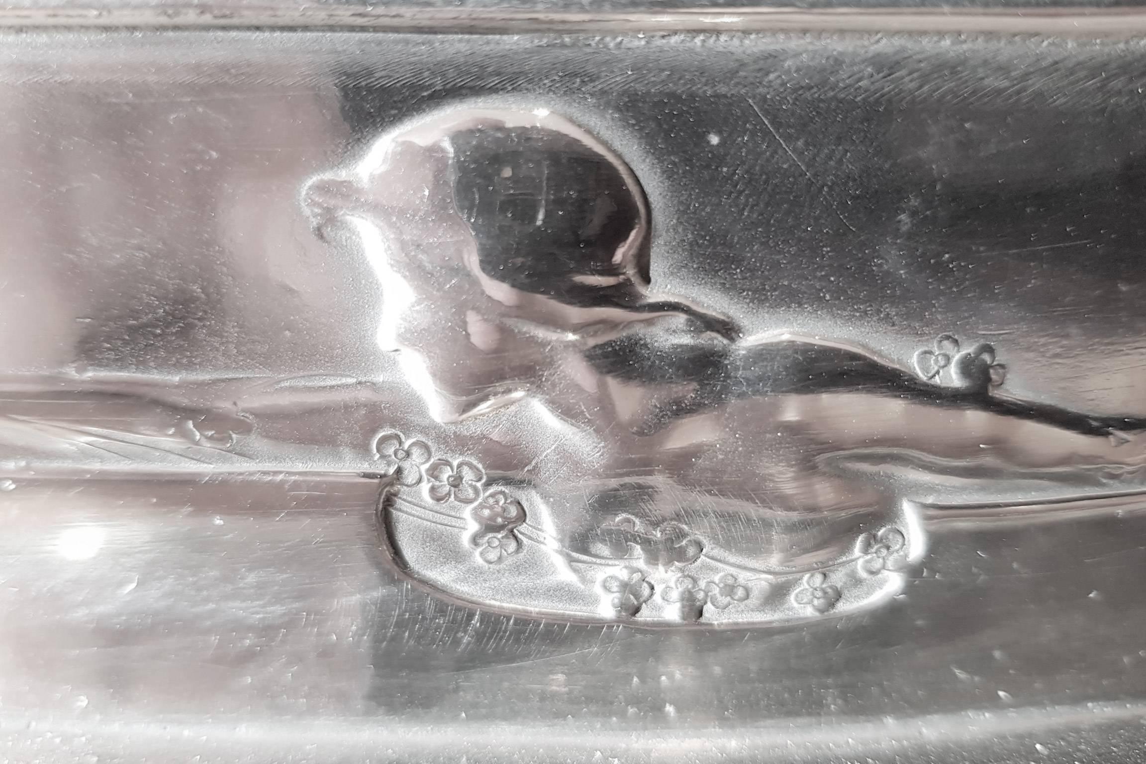 The beautiful maiden motif on this Pewter Butter Dish is pure Art Nouveau. The design is known on silver by Kate Harris for William Hutton of Sheffield. Some of Harris's designs were later produced by Huttons in pewter, with Connels of Cheapside