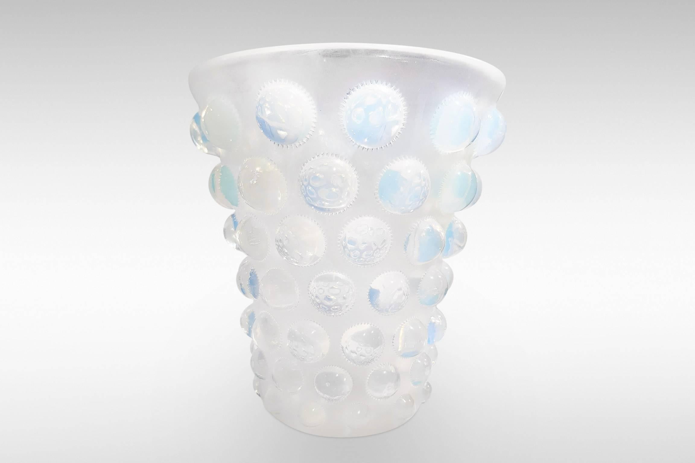 'Bammako' by Rene Lalique is a striking Art Deco vase design with roundels in opalescent glass,
circa 1930, signed.