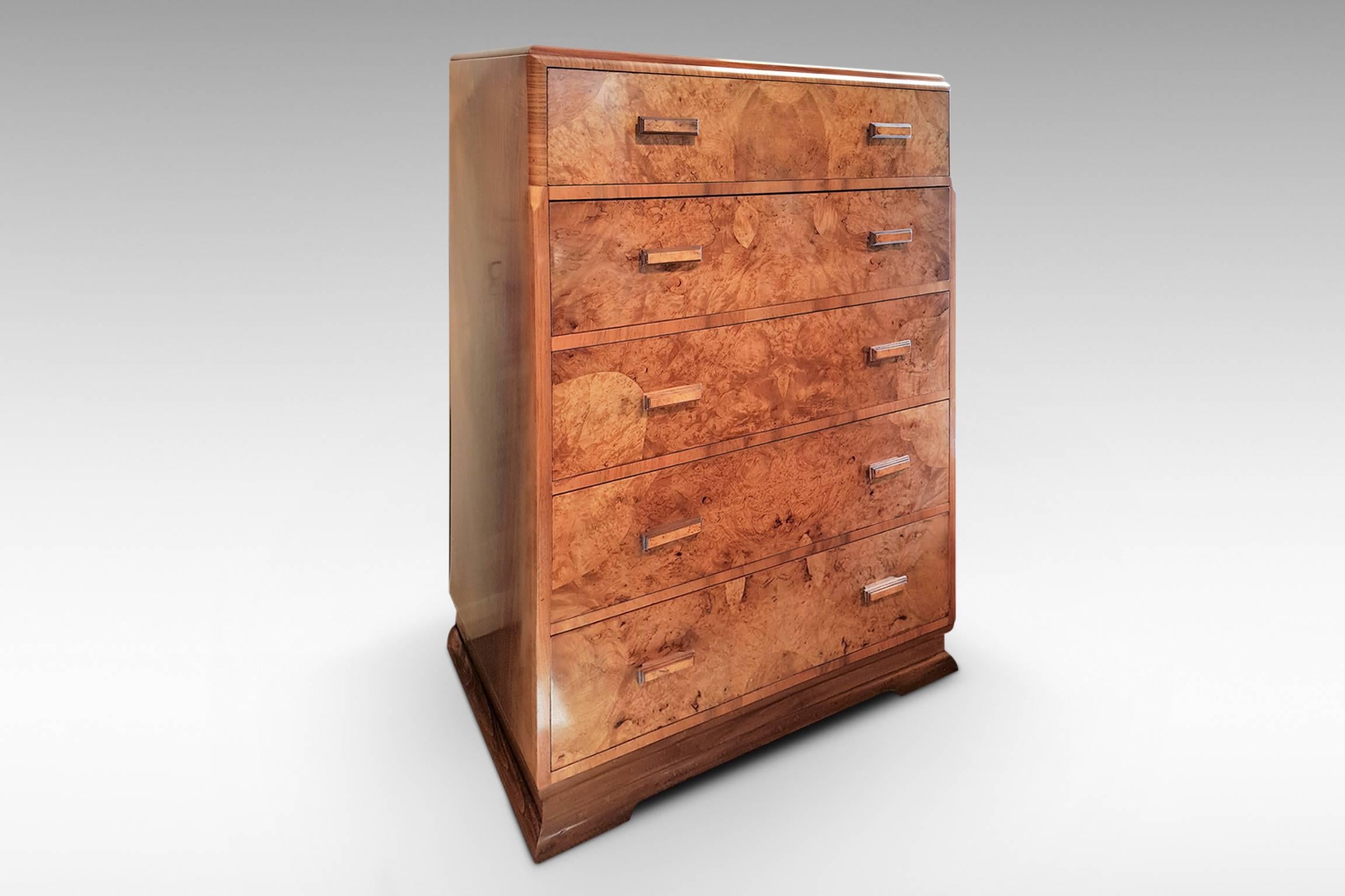 An attractive Art Deco chest of five drawers with intricately matching figured walnut veneers,
circa 1935.
 