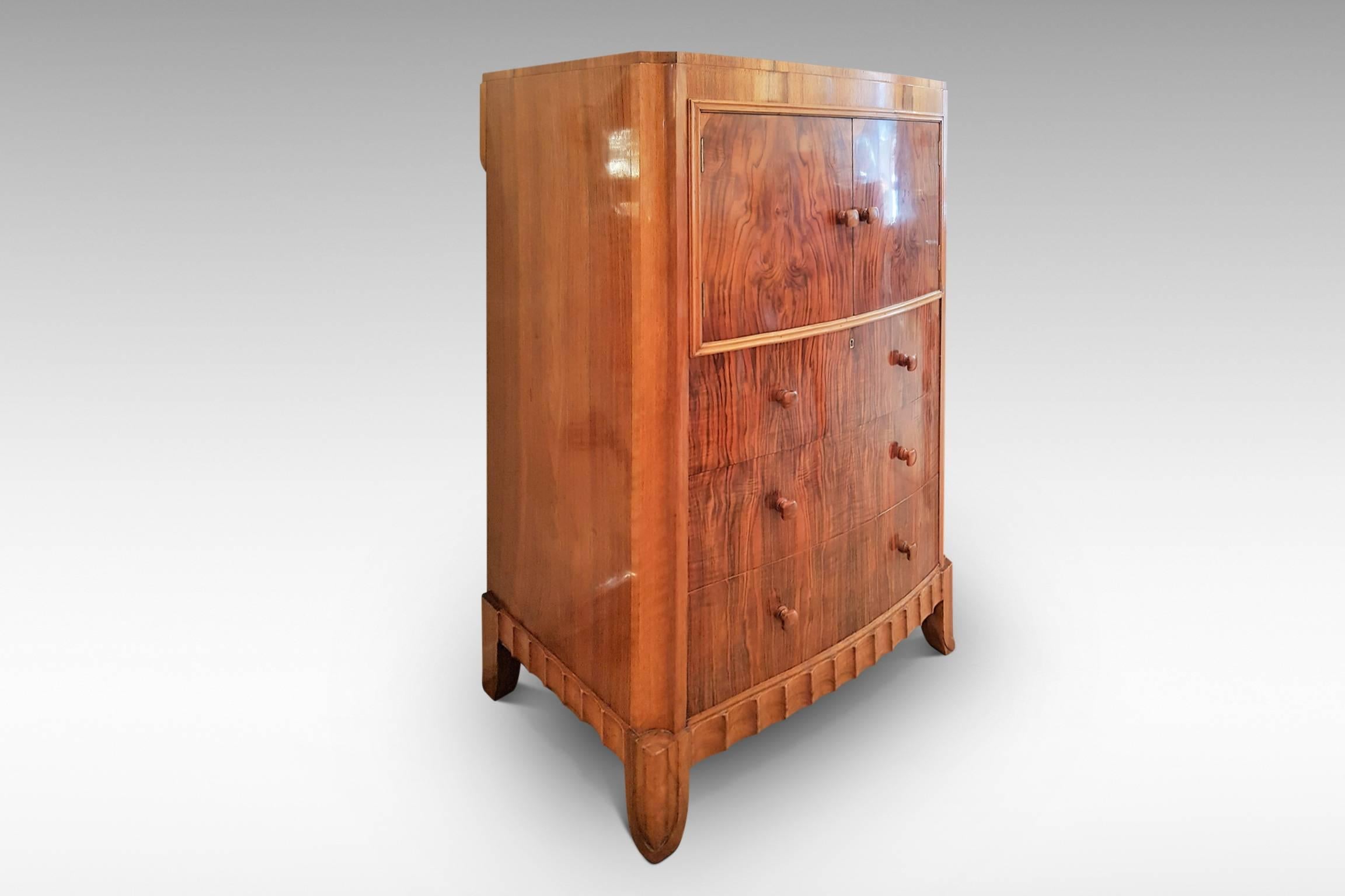 A delightful Art Deco tallboy chest with three drawers and cupboard which is attributed to Serge Chermayeff, the Artistic Director of Waring & Gillow and co-architect of the iconic modernist De La Warr Pavilion in Bexhill, England. This piece is of