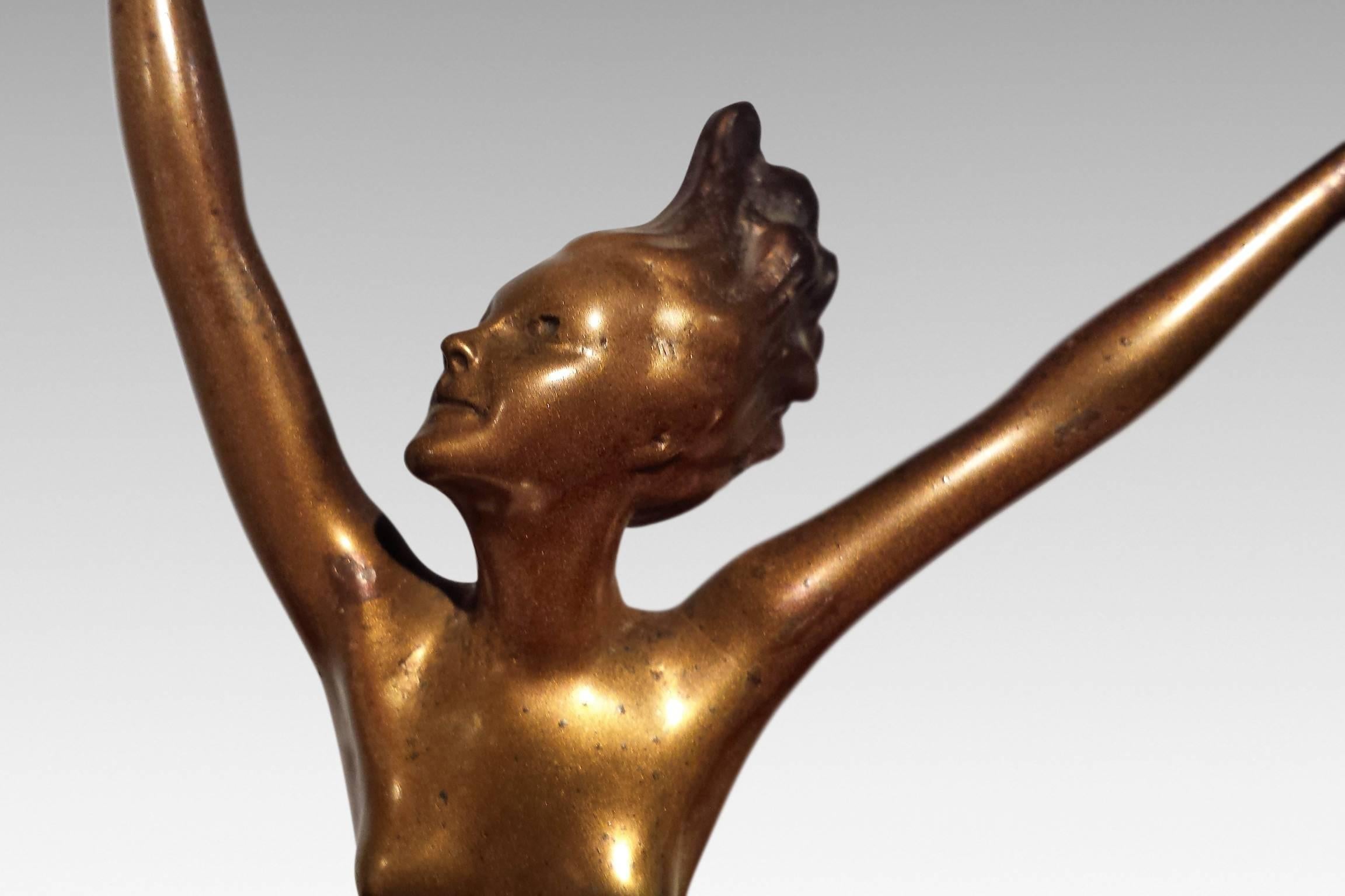 'Sophie', an original Art Deco bronze dancer by Joseph Adolph. 
Adolph was an Austrian designer who created exuberant, aerodynamic figurines between 1910 and 1939. Excellent condition. Signed.