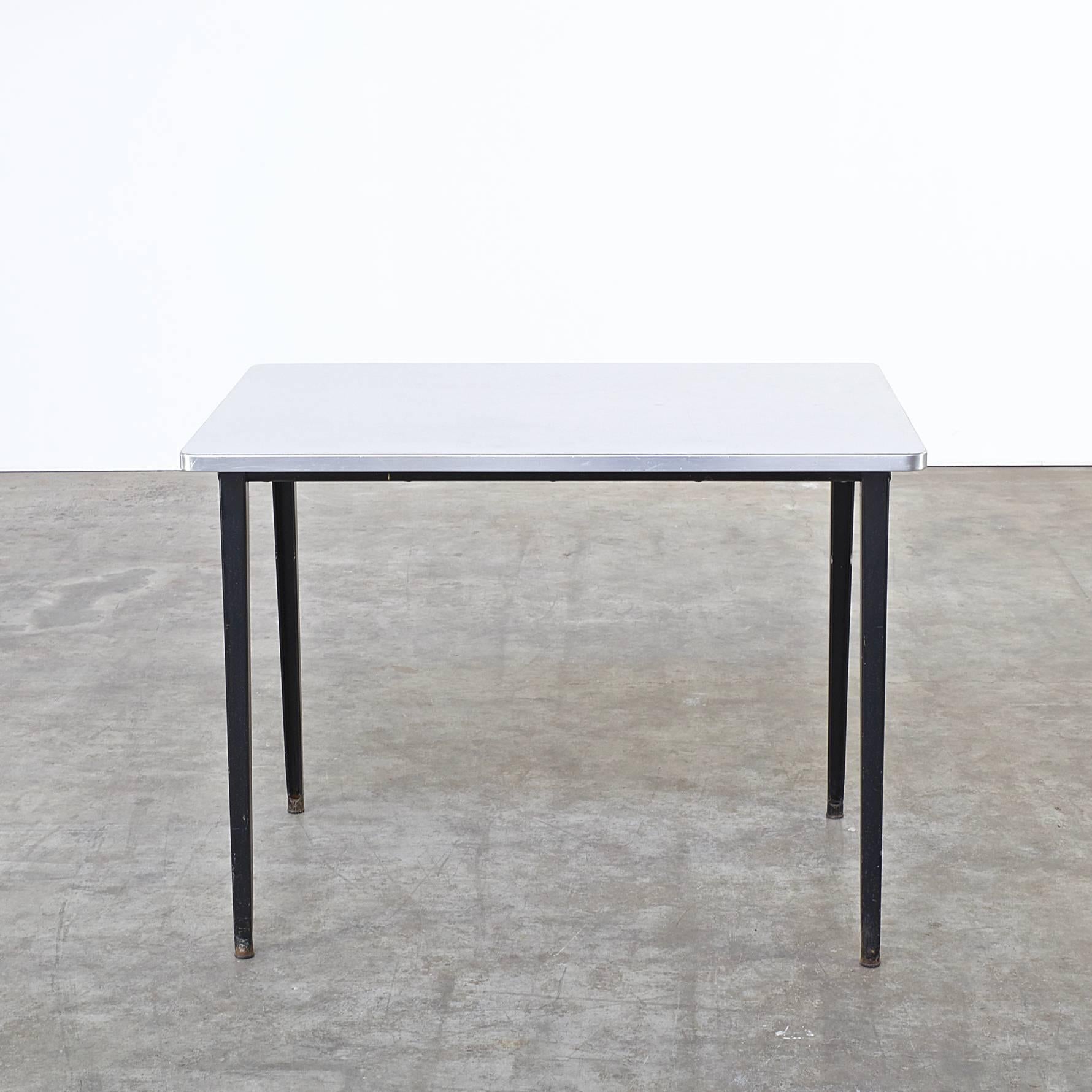 1960s Friso Kramer ‘Reform’ table for Gispen. Firm, fair condition. Wear consistent with age and use. Steel frame, formica worktop. Dimensions: 100cm (W) x 69cm (D) x 75cm (H).