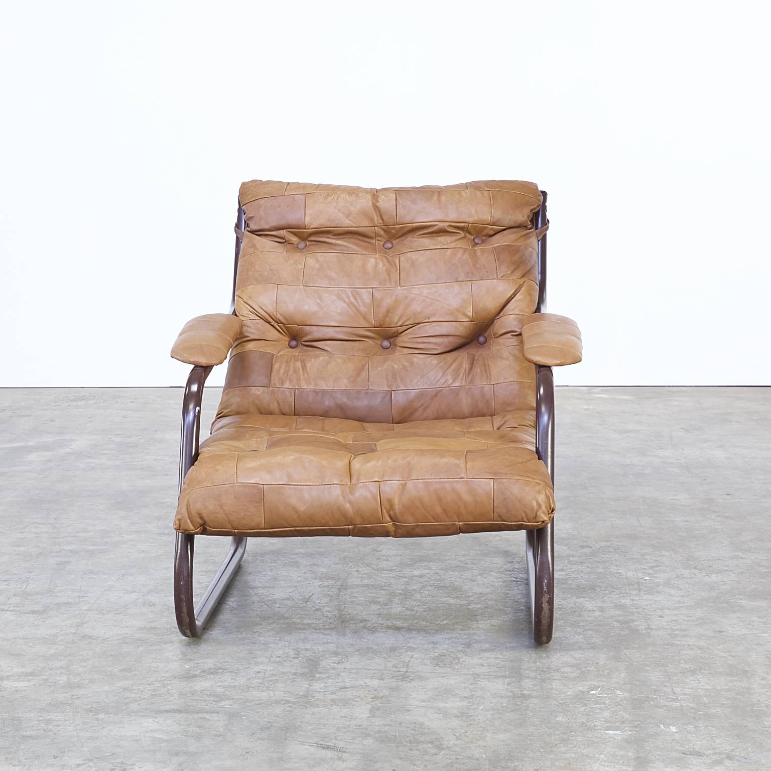1970s vintage cognac leather patchwork fauteuil. Leather patchwork, cognac. Good condition, wear consistent with age and use. Dimensions: 75cm W x 80cm D x 76cm H x 34cm seat.